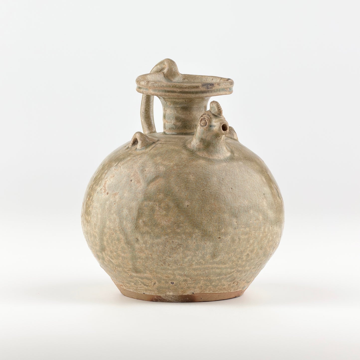 A RARE YUE CELADON CHICKEN-HEAD EWER, JIN-SOUTHERN DYNASTY