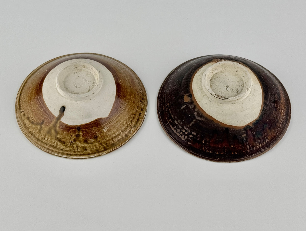 Pair of 15th-century Vietnamese Annamese stoneware bowls with carved floral decoration and olive-green to iron-brown glaze.