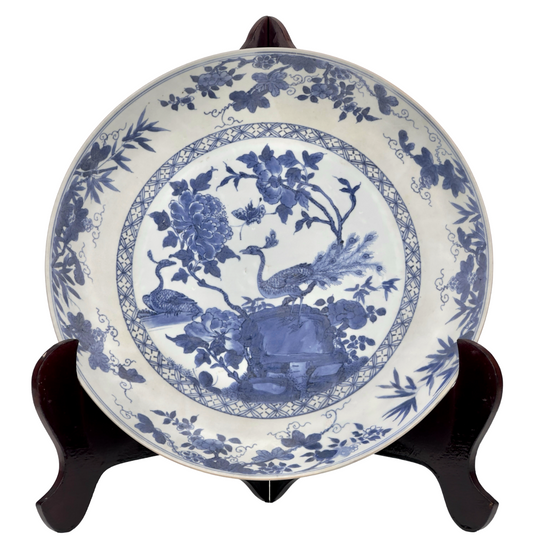 PEACOCK IN SPLENDOUR PATTERN BLUE AND WHITE DISH CIRCA 1725, QING DYNASTY, YONGZHENG