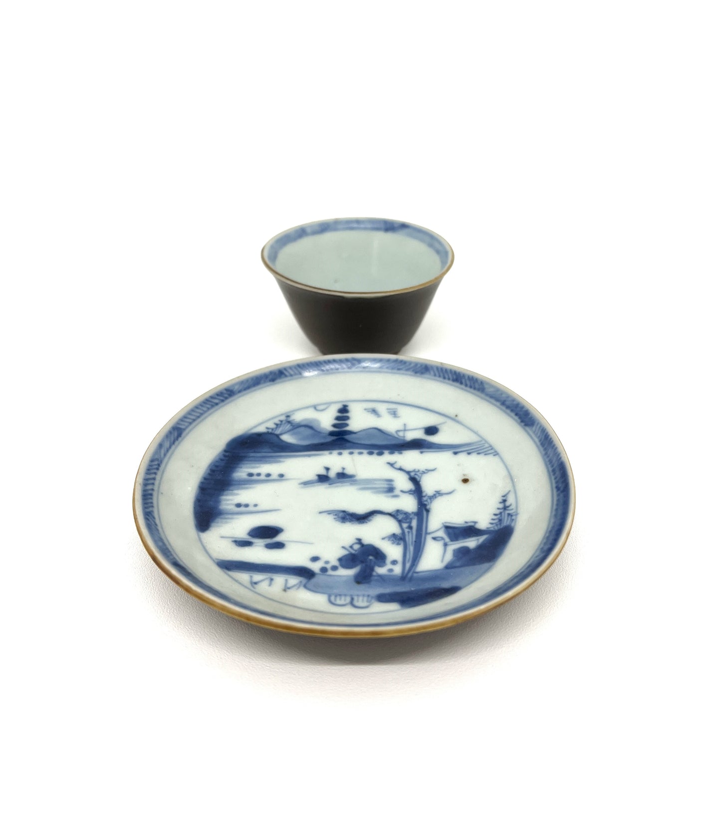 PASSING BOAT AND BRIDGE PATTERN BLUE AND WHITE TEABOWL AND SAUCER SET CIRCA 1725, QING DYNASTY, YONGZHENG ERA