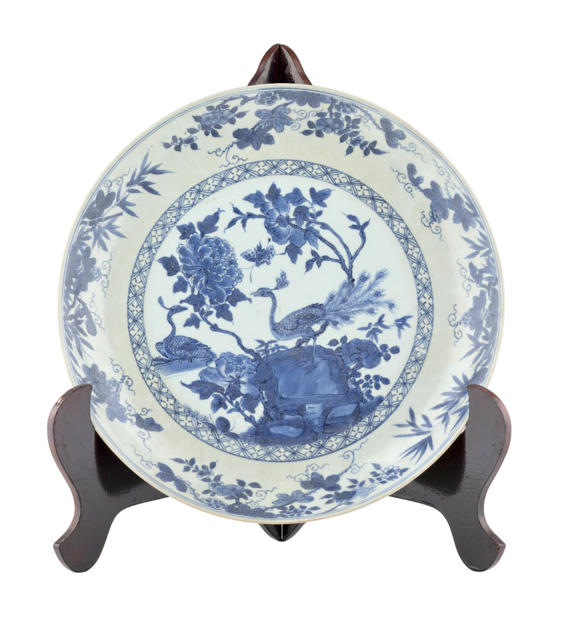 PEACOCK IN SPLENDOUR PATTERN BLUE AND WHITE DISH CIRCA 1725, QING DYNASTY, YONGZHENG