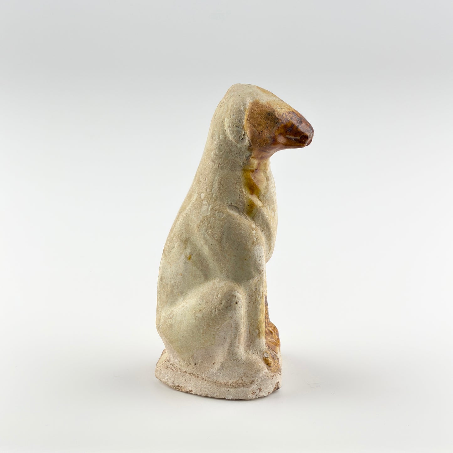 AMBER-GLAZED POTTERY FIGURE OF DOG, TANG-LIAO DYNASTY (7-12TH CENTURY)