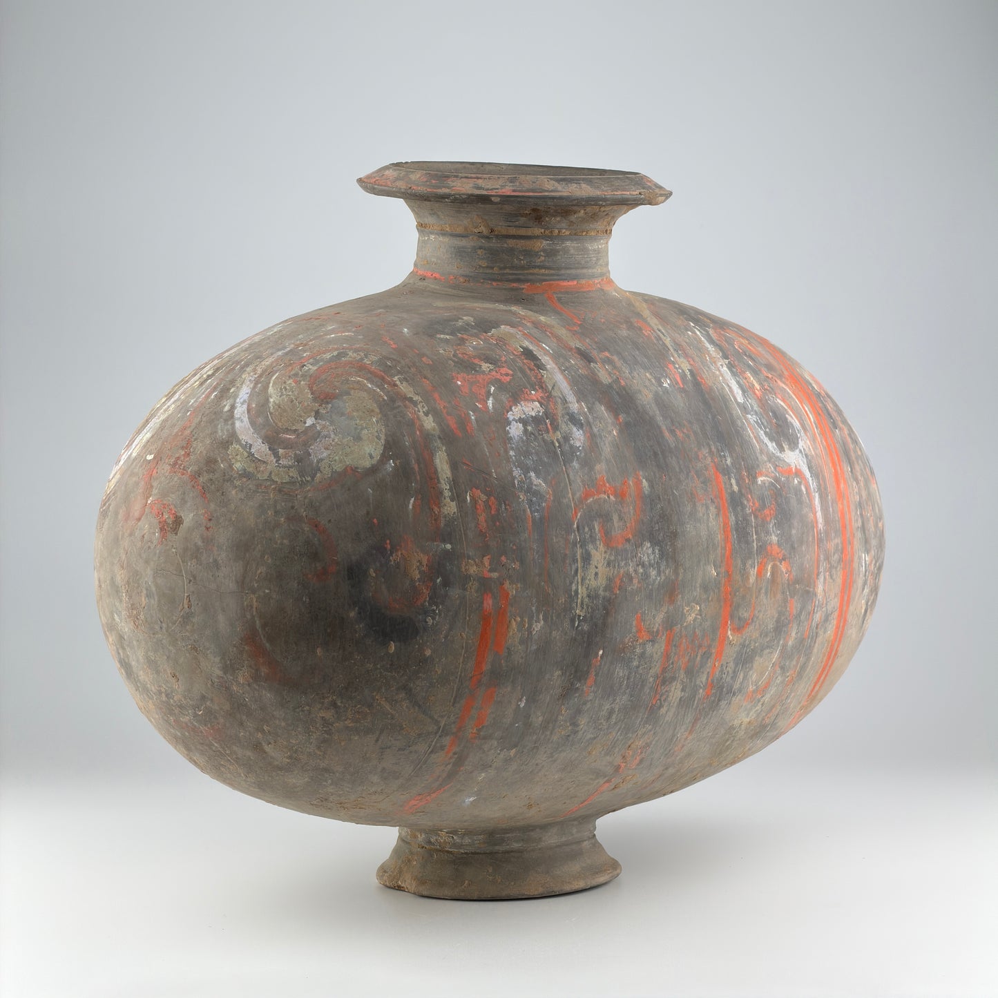COCOON-SHAPED JAR WITH CLOUD-SCROLL DESIGN, HAN DYNASTY