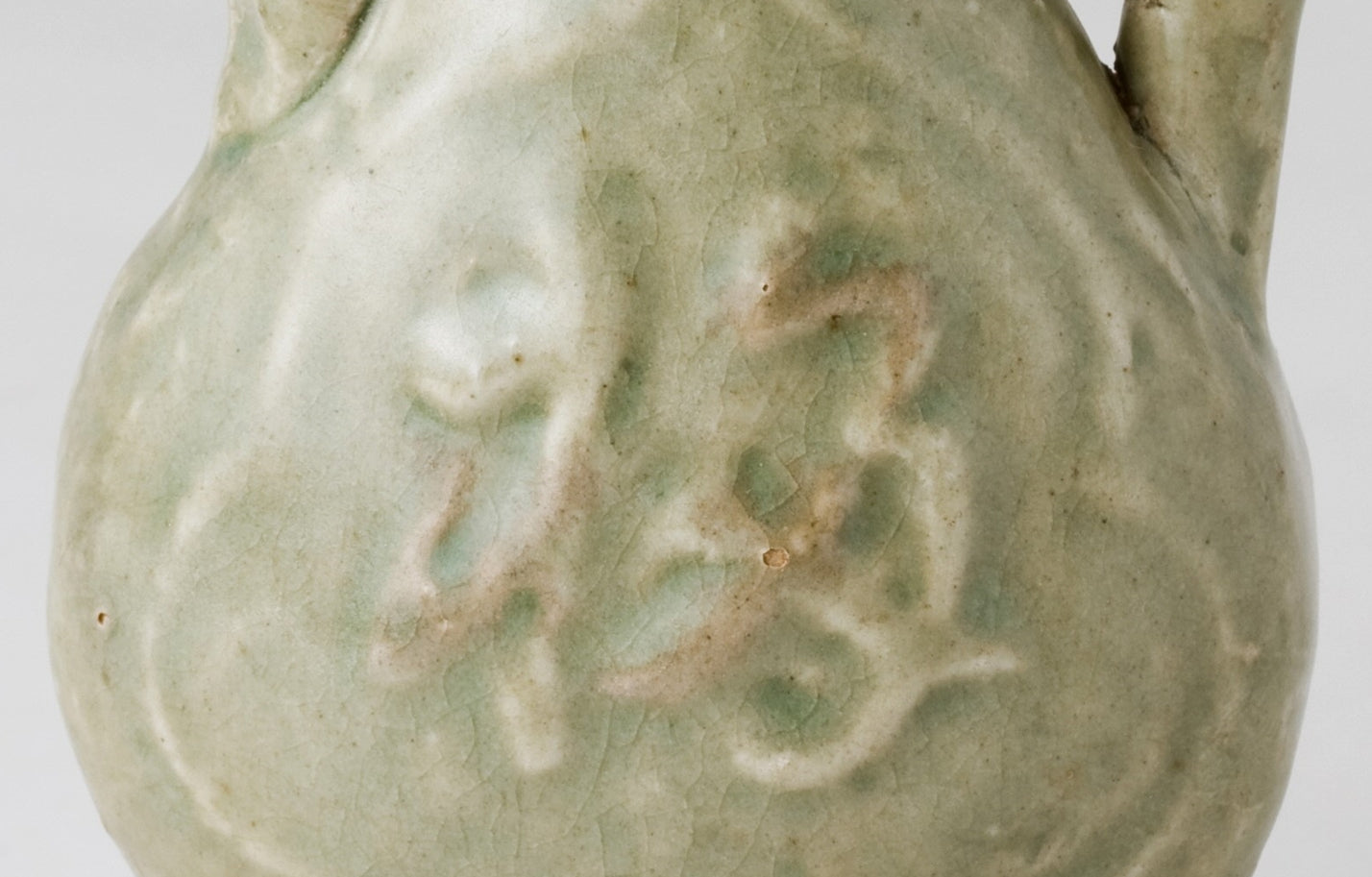 MOLDED LONGQUAN CELADON 'FU SHOU' EWER, MING DYNASTY