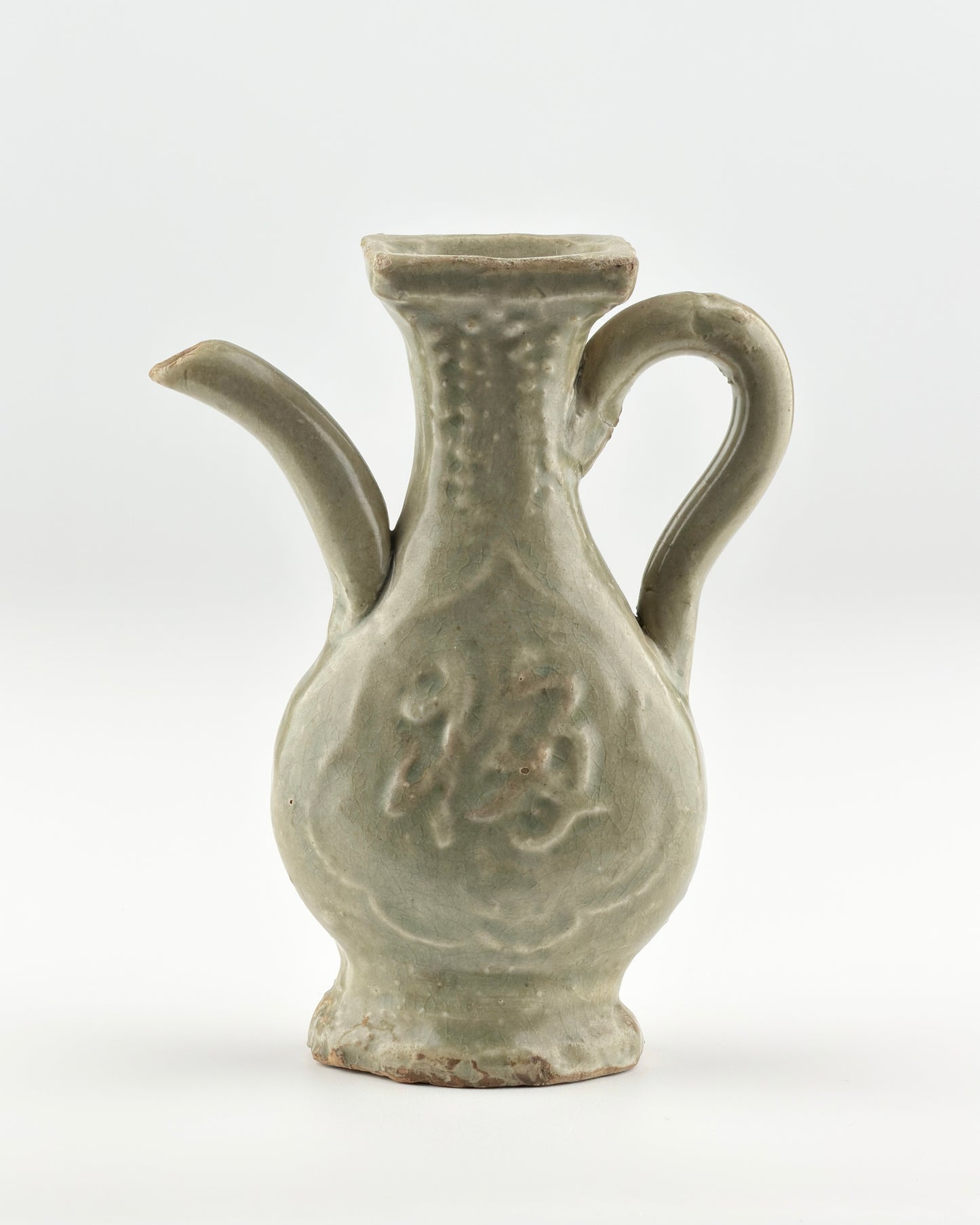 MOLDED LONGQUAN CELADON 'FU SHOU' EWER, MING DYNASTY