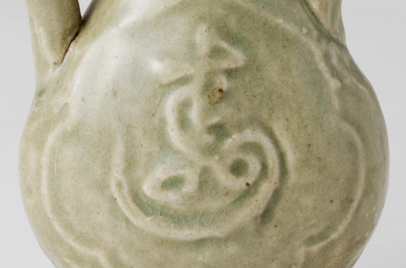 MOLDED LONGQUAN CELADON 'FU SHOU' EWER, MING DYNASTY