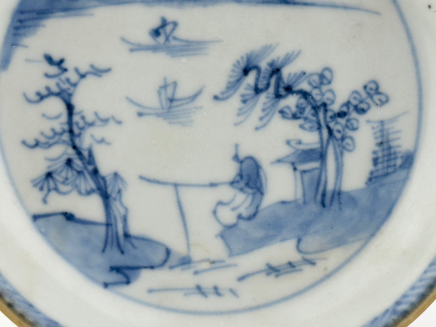 PASSING BOAT AND FIGURE PATTERN BLUE AND WHITE SAUCER, CIRCA 1725, QING DYNASTY, YONGZHENG ERA