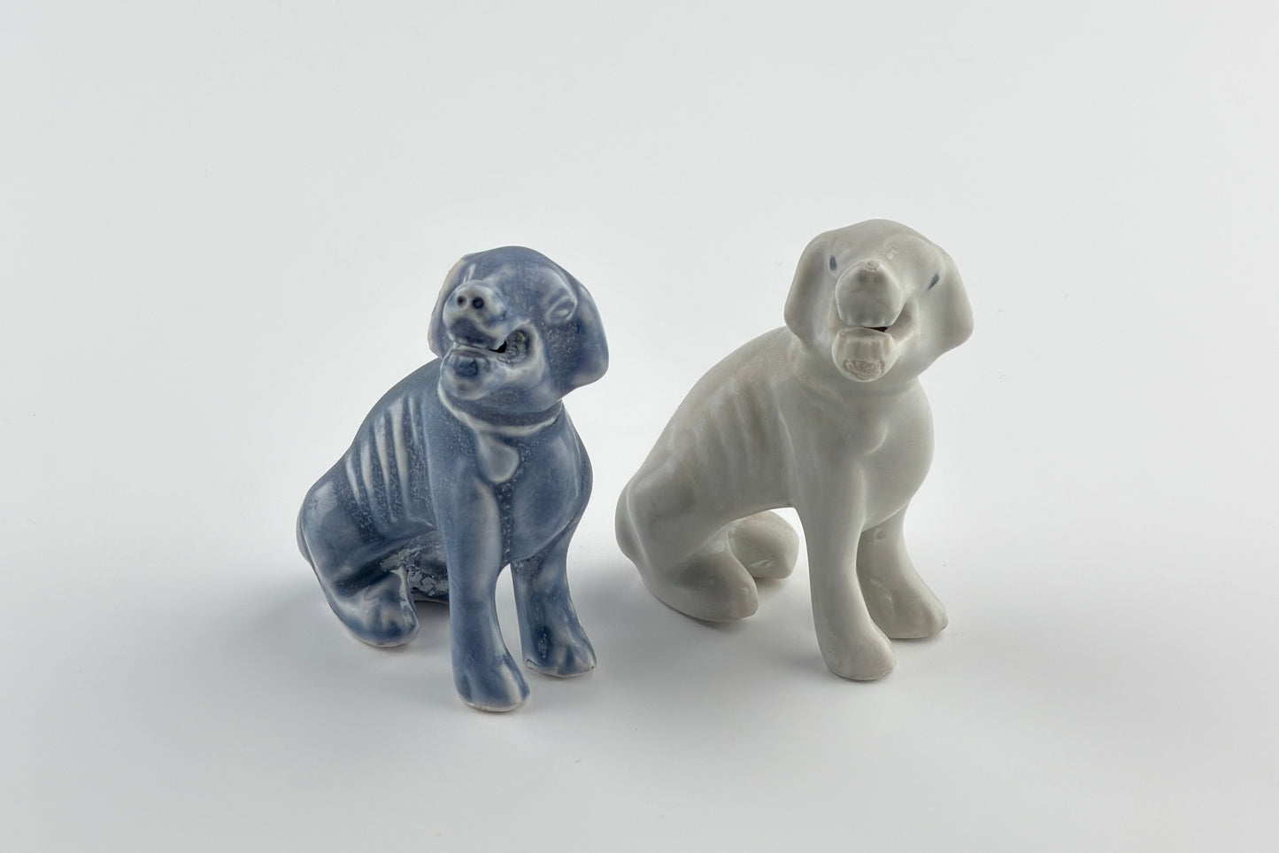 Two Miniature White Figure of Seated Hounds, Circa 1725, Qing Dynasty, Yongzheng reign