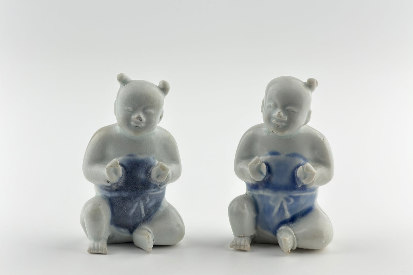 Two Miniature Figurine Of Seated Boys, Circa 1725, Qing Dynasty, Yongzheng Reign