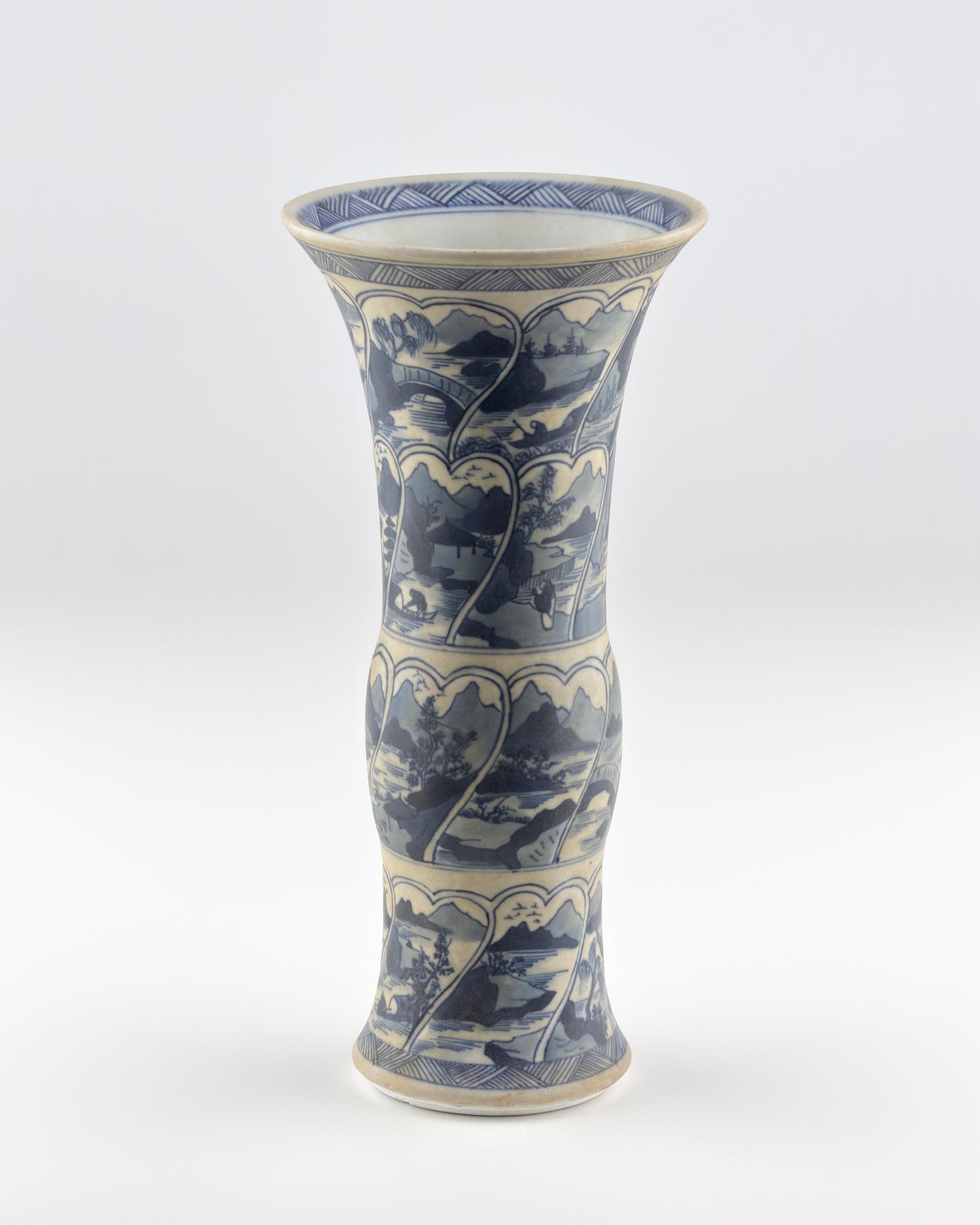 ANCIENT GU SHAPE BLUE AND WHITE 'RIVERSCAPES' VASE, QING DYNASTY, KANGXI ERA, CIRCA 1690