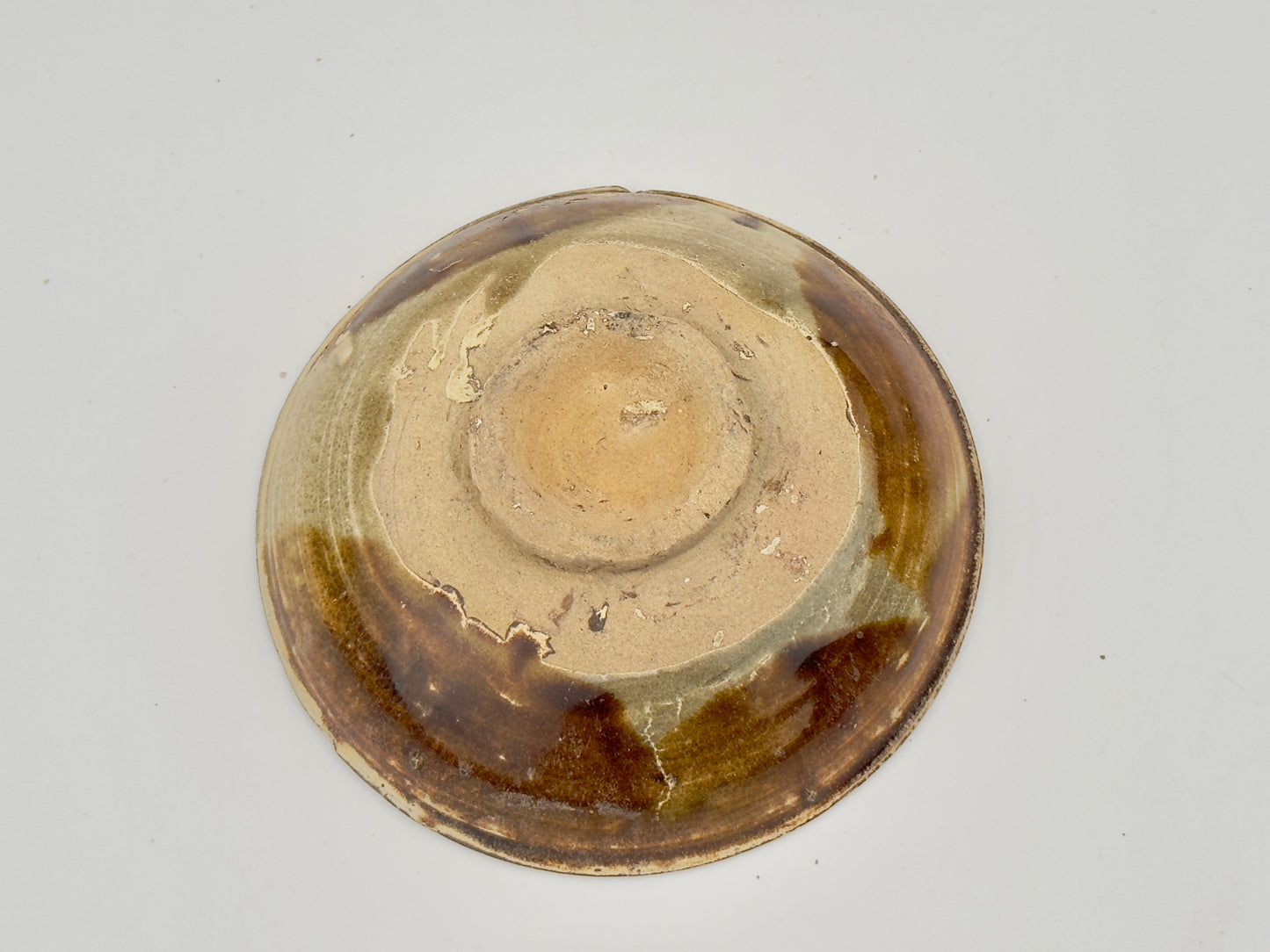 BELITUNG SHIP, CHANGSHA BOWL WITH ABSTRACT PATTERNS PRESUMED TO BE ISLAMIC SYMBOLS, TANG PERIOD