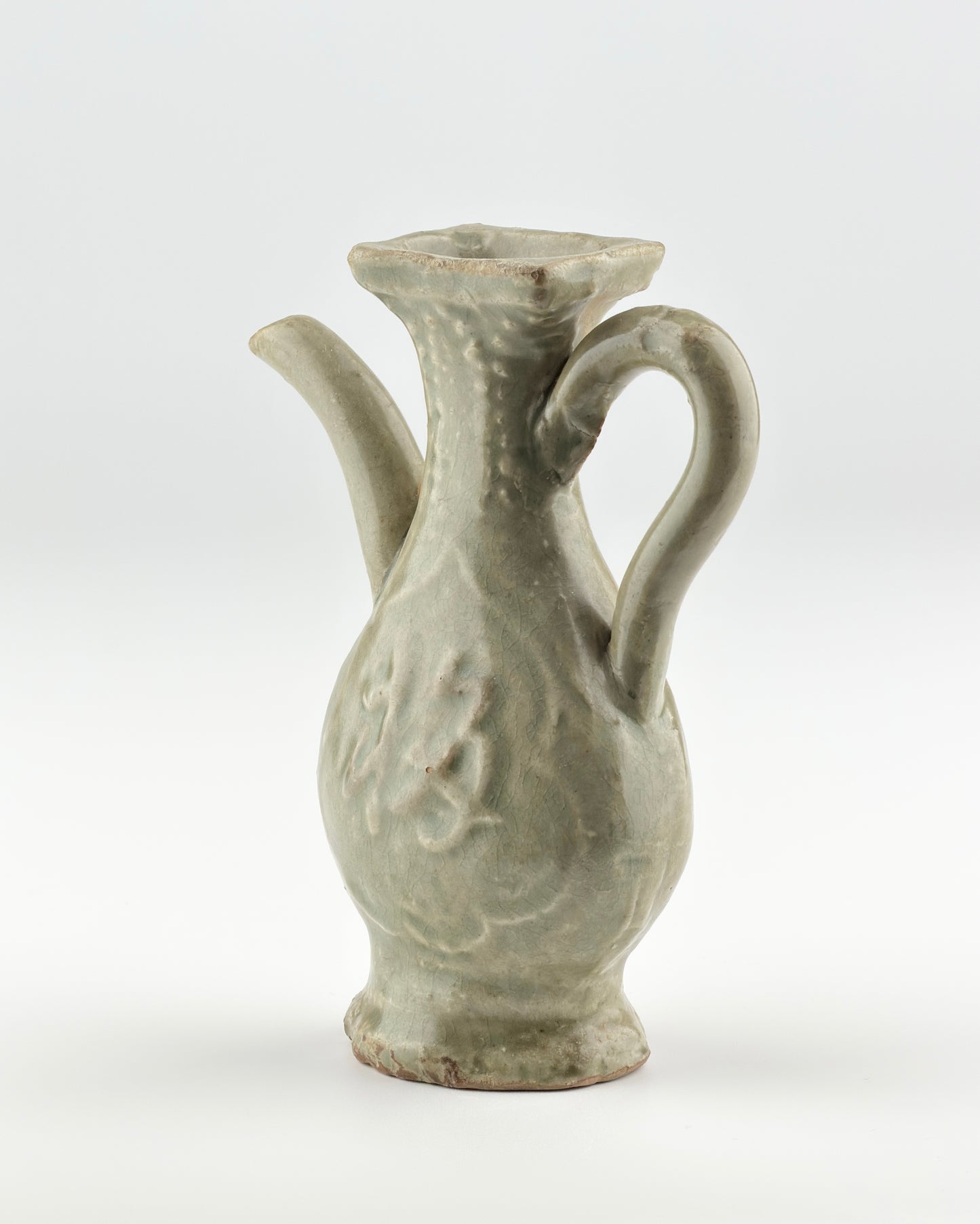 MOLDED LONGQUAN CELADON 'FU SHOU' EWER, MING DYNASTY