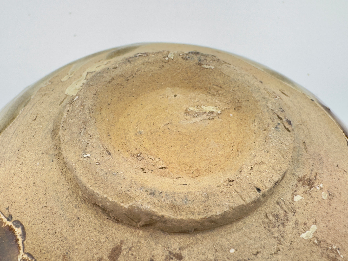 BELITUNG SHIP, CHANGSHA BOWL WITH ABSTRACT PATTERNS PRESUMED TO BE ISLAMIC SYMBOLS, TANG PERIOD