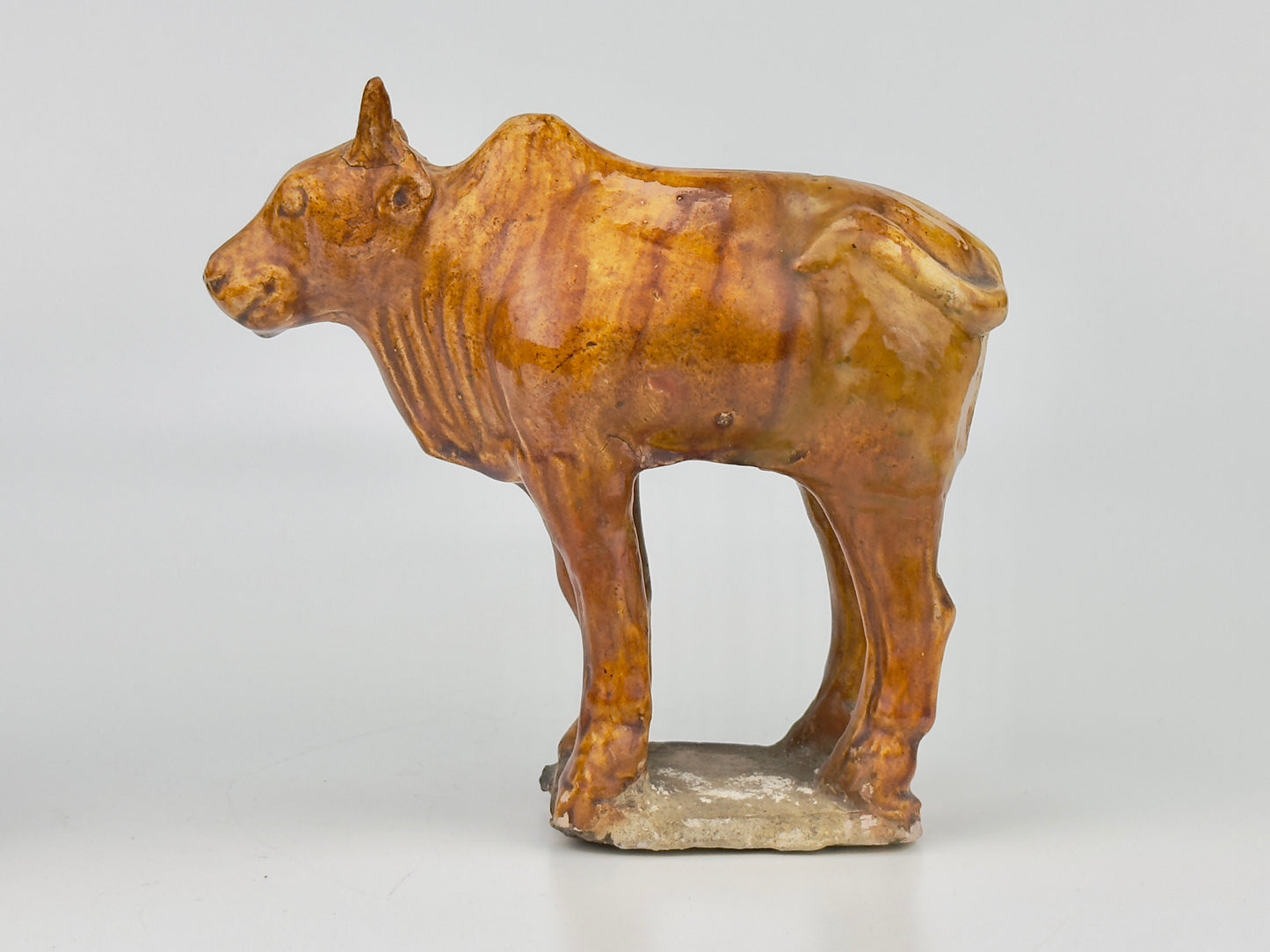 AMBER-GLAZED POTTERY FIGURE OF TWO SACRED BULLS, TANG-LIAO DYNASTY (7-12TH CENTURY)