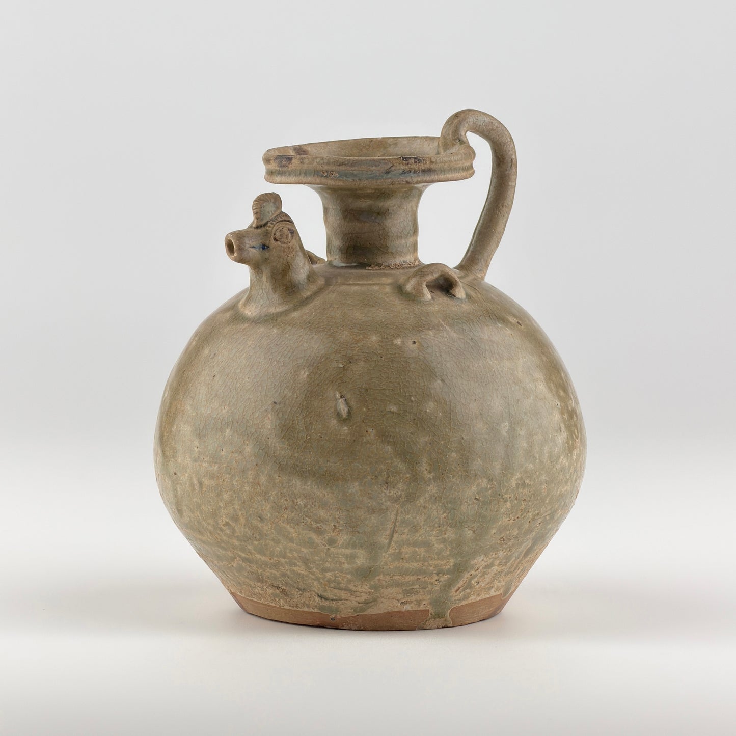 A RARE YUE CELADON CHICKEN-HEAD EWER, JIN-SOUTHERN DYNASTY