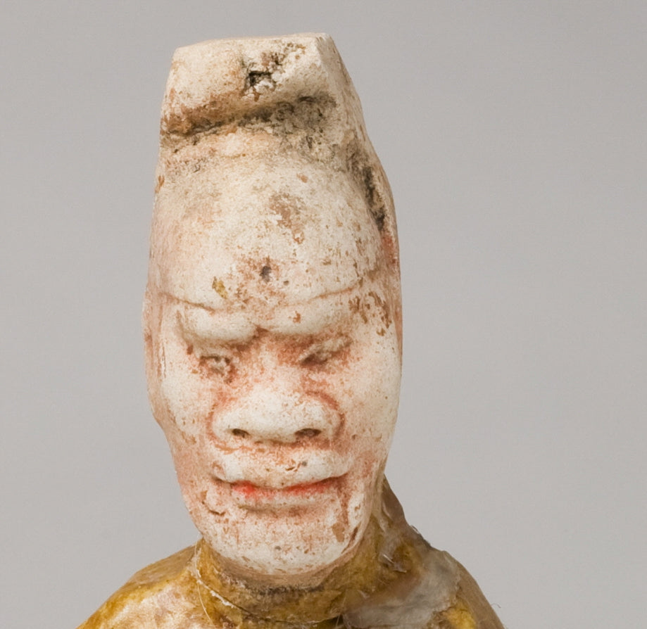 AMBER-GLAZED POTTERY FIGURE OF AN FOREIGN OFFICIAL, TANG-LIAO DYNASTY (7-12TH CENTURY)