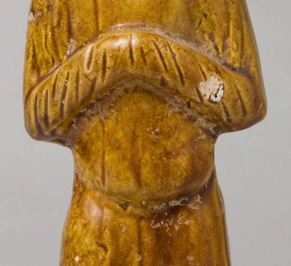 AMBER-GLAZED POTTERY FIGURE OF AN FOREIGN OFFICIAL, TANG-LIAO DYNASTY (7-12TH CENTURY)