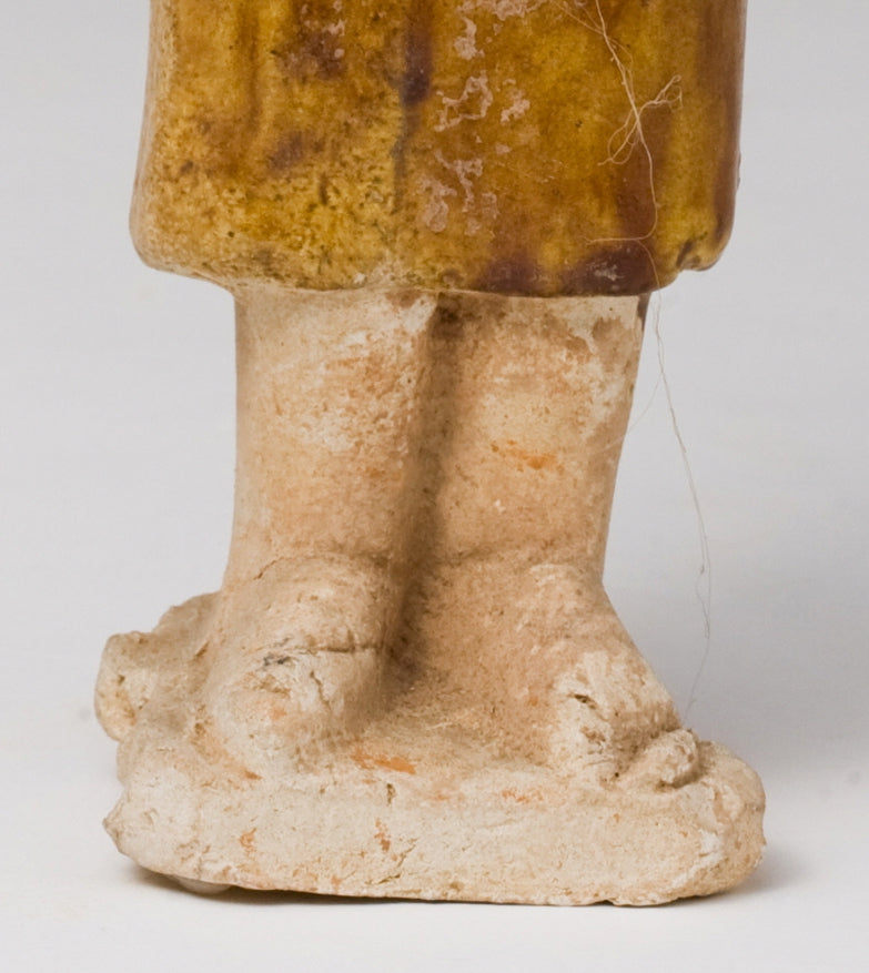 AMBER-GLAZED POTTERY FIGURE OF AN FOREIGN OFFICIAL, TANG-LIAO DYNASTY (7-12TH CENTURY)