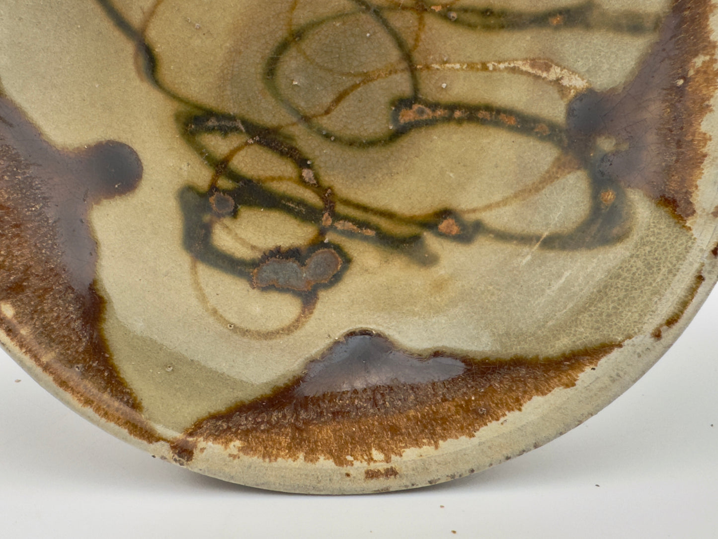 BELITUNG SHIP, CHANGSHA BOWL WITH ABSTRACT PATTERNS PRESUMED TO BE ISLAMIC SYMBOLS, TANG PERIOD