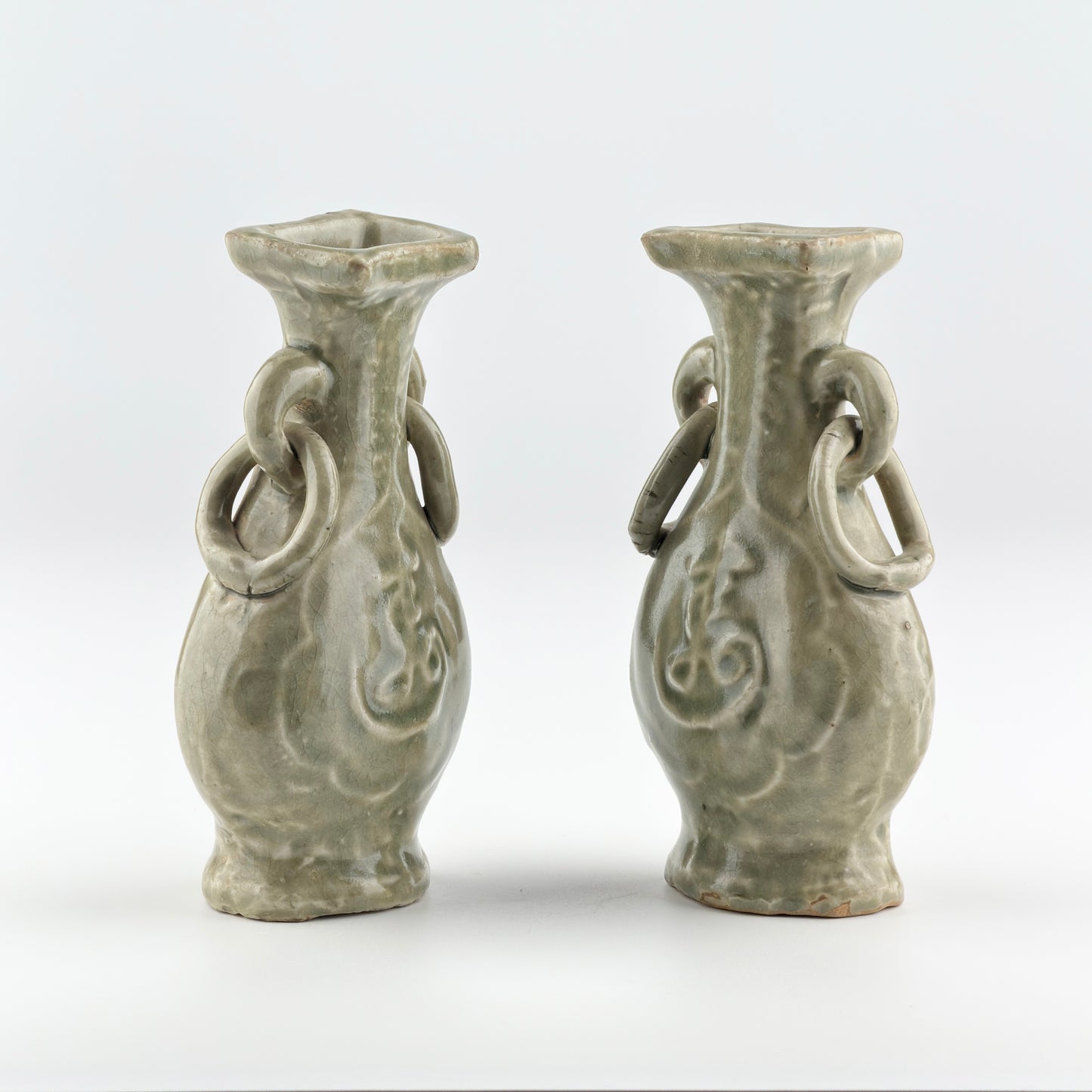 TWO MOLDED LONGQUAN CELADON 'FU SHOU' VASES, MING DYNASTY
