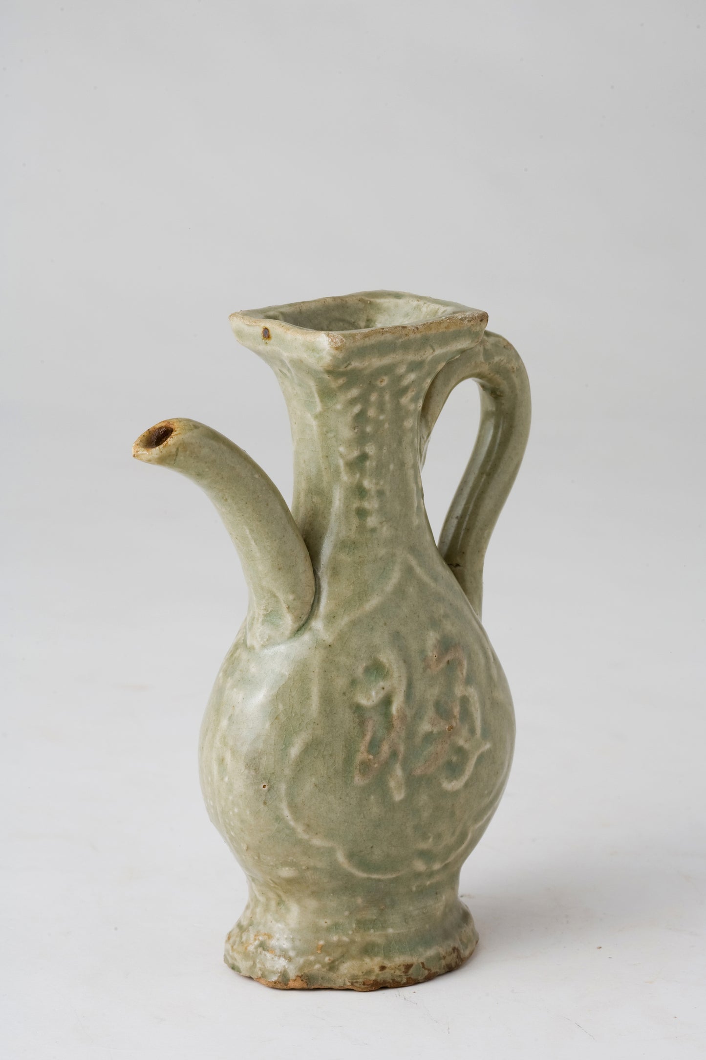 MOLDED LONGQUAN CELADON 'FU SHOU' EWER, MING DYNASTY