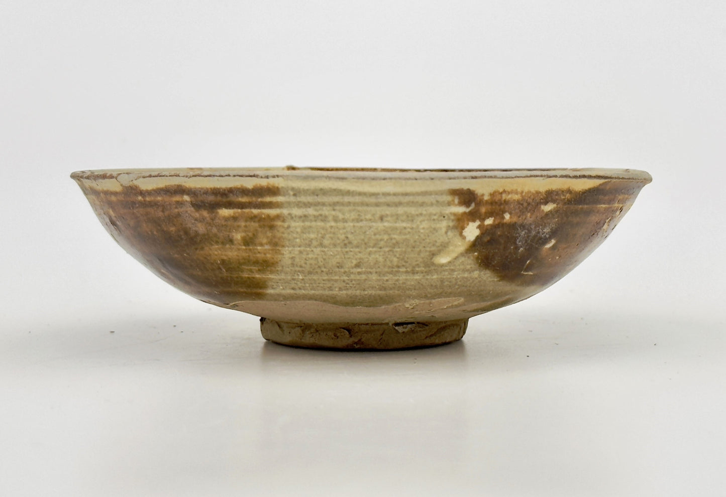 BELITUNG SHIP, CHANGSHA BOWL WITH ABSTRACT PATTERNS PRESUMED TO BE ISLAMIC SYMBOLS, TANG PERIOD