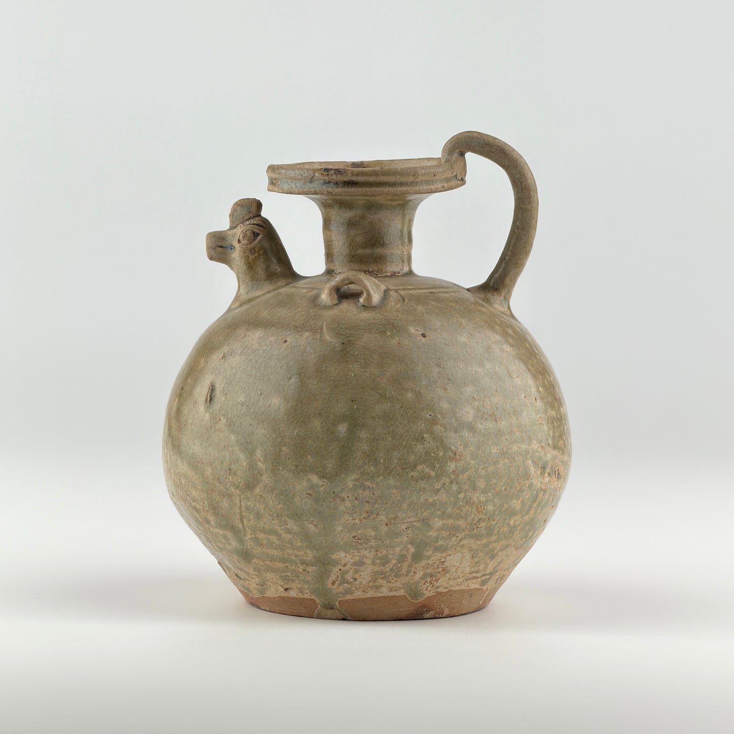 A RARE YUE CELADON CHICKEN-HEAD EWER, JIN-SOUTHERN DYNASTY