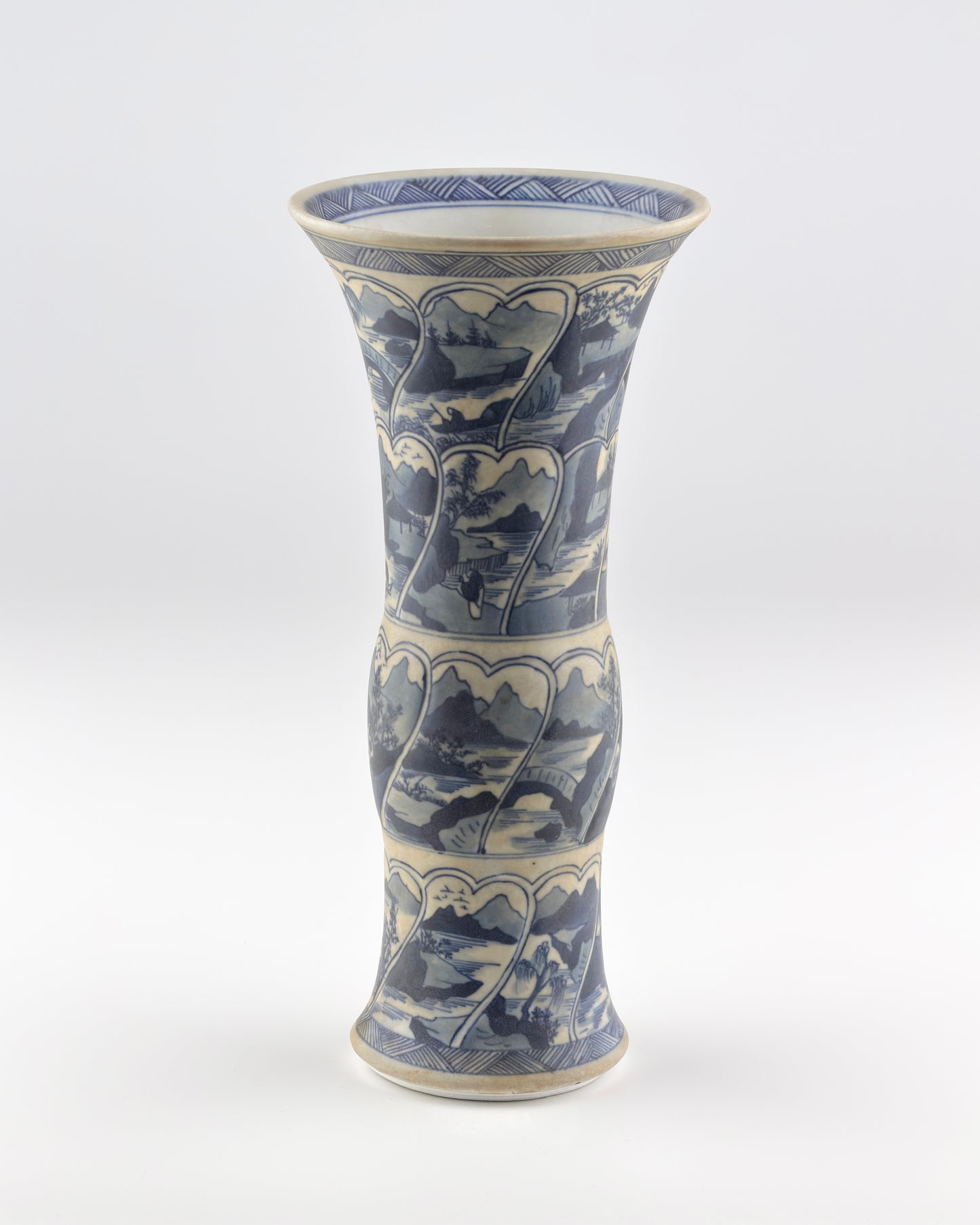 ANCIENT GU SHAPE BLUE AND WHITE 'RIVERSCAPES' VASE, QING DYNASTY, KANGXI ERA, CIRCA 1690