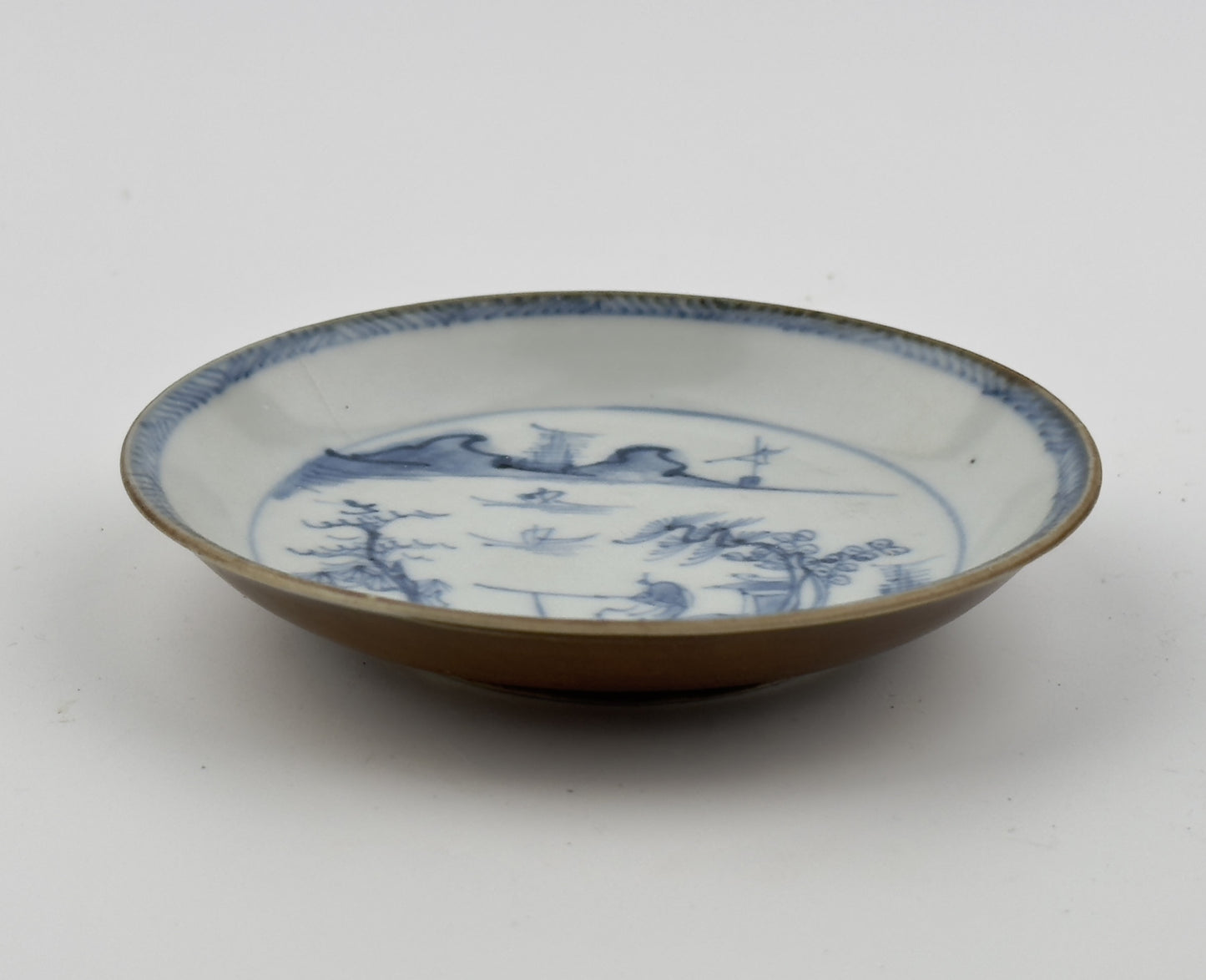 PASSING BOAT AND FIGURE PATTERN BLUE AND WHITE SAUCER, CIRCA 1725, QING DYNASTY, YONGZHENG ERA