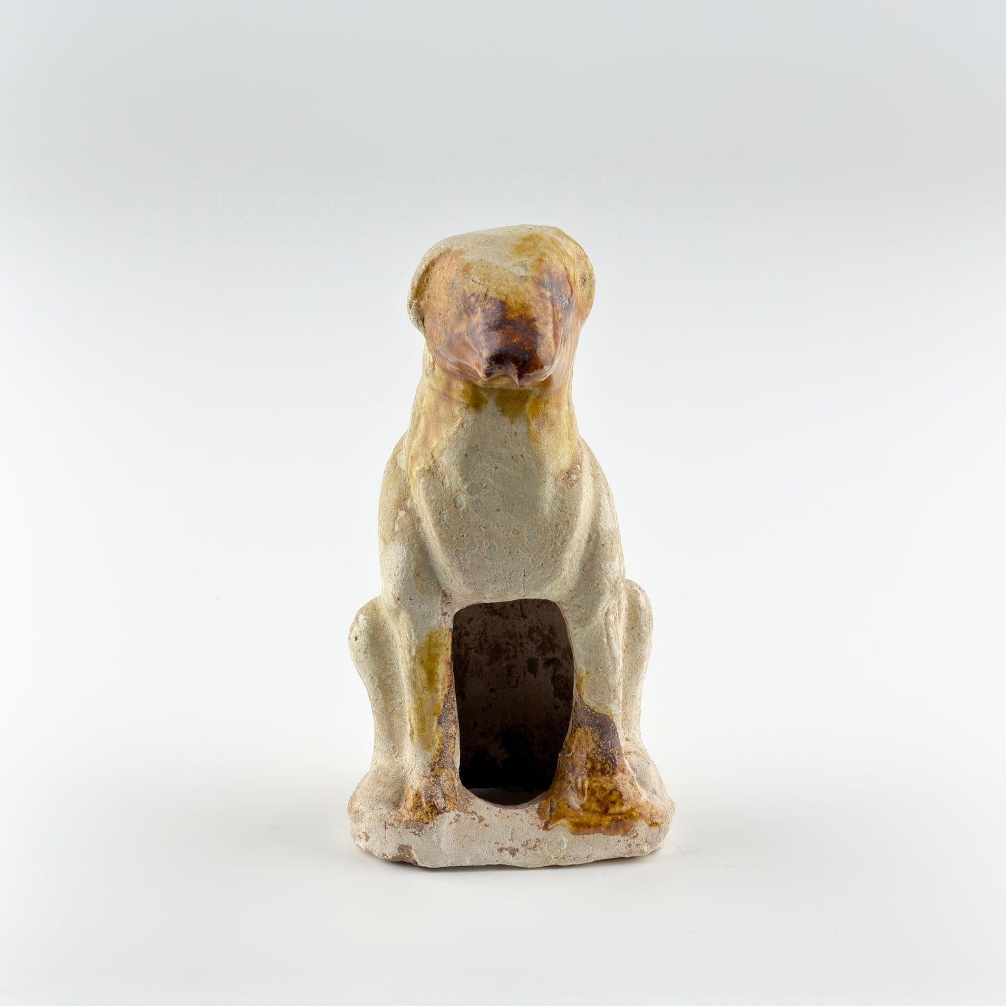 AMBER-GLAZED POTTERY FIGURE OF DOG, TANG-LIAO DYNASTY (7-12TH CENTURY)
