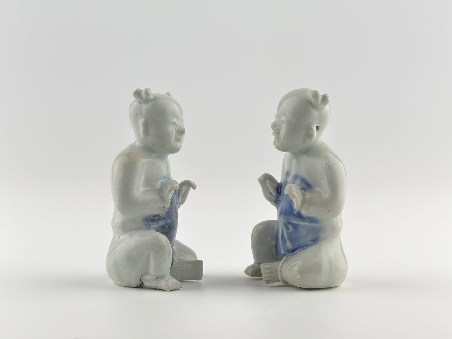 Two Miniature Figurine Of Seated Boys, Circa 1725, Qing Dynasty, Yongzheng Reign