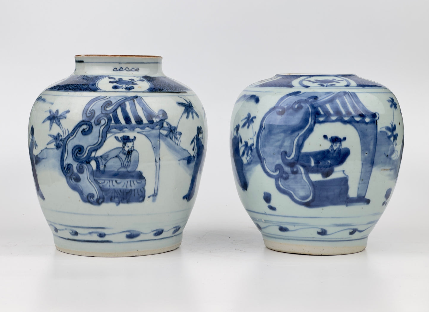 Two Chinese blue and white jars, painted with eight figures in a garden, marked on the bottom with a sitting rabbit(blue hare), Transitional period(Late Ming dynasty)