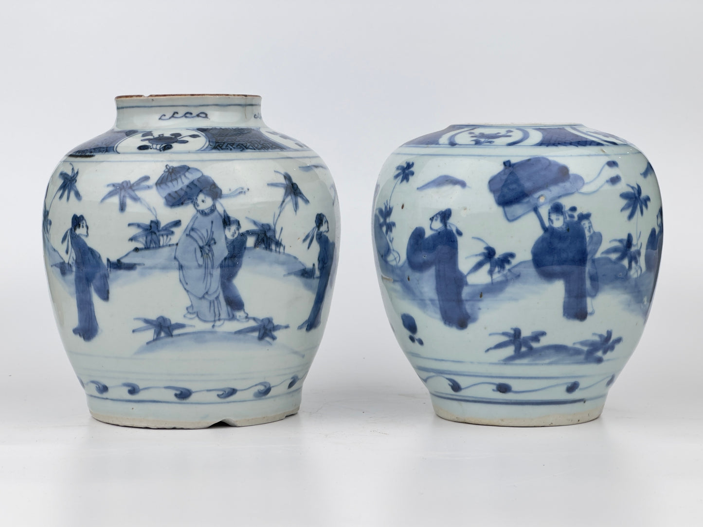 Two Chinese blue and white jars, painted with eight figures in a garden, marked on the bottom with a sitting rabbit(blue hare), Transitional period(Late Ming dynasty)