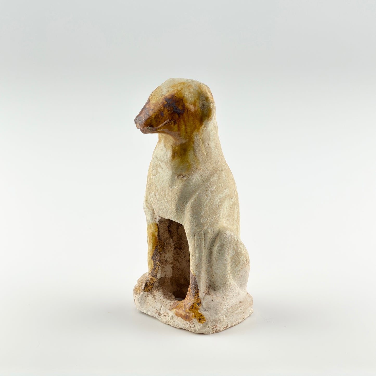 AMBER-GLAZED POTTERY FIGURE OF DOG, TANG-LIAO DYNASTY (7-12TH CENTURY)