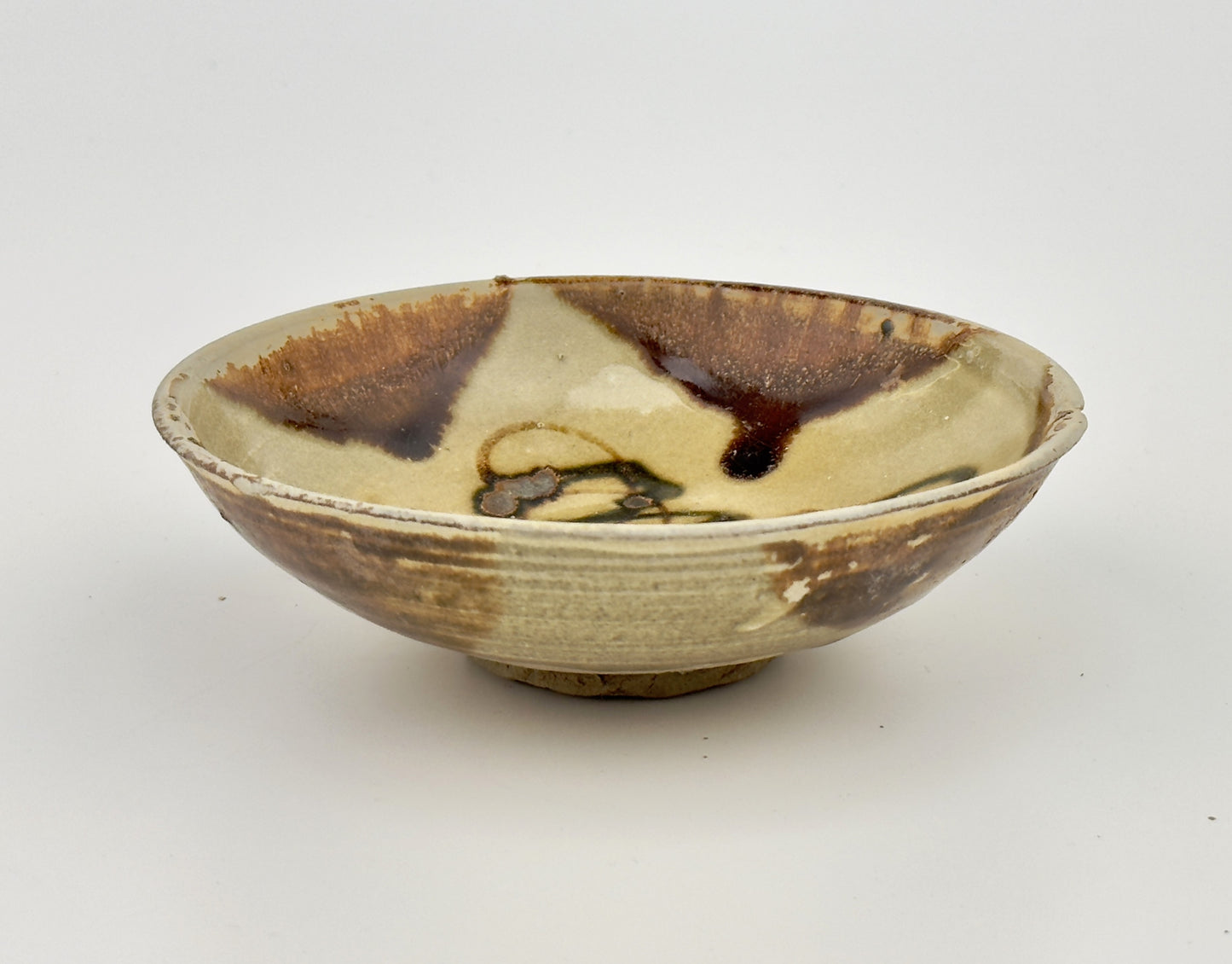 BELITUNG SHIP, CHANGSHA BOWL WITH ABSTRACT PATTERNS PRESUMED TO BE ISLAMIC SYMBOLS, TANG PERIOD