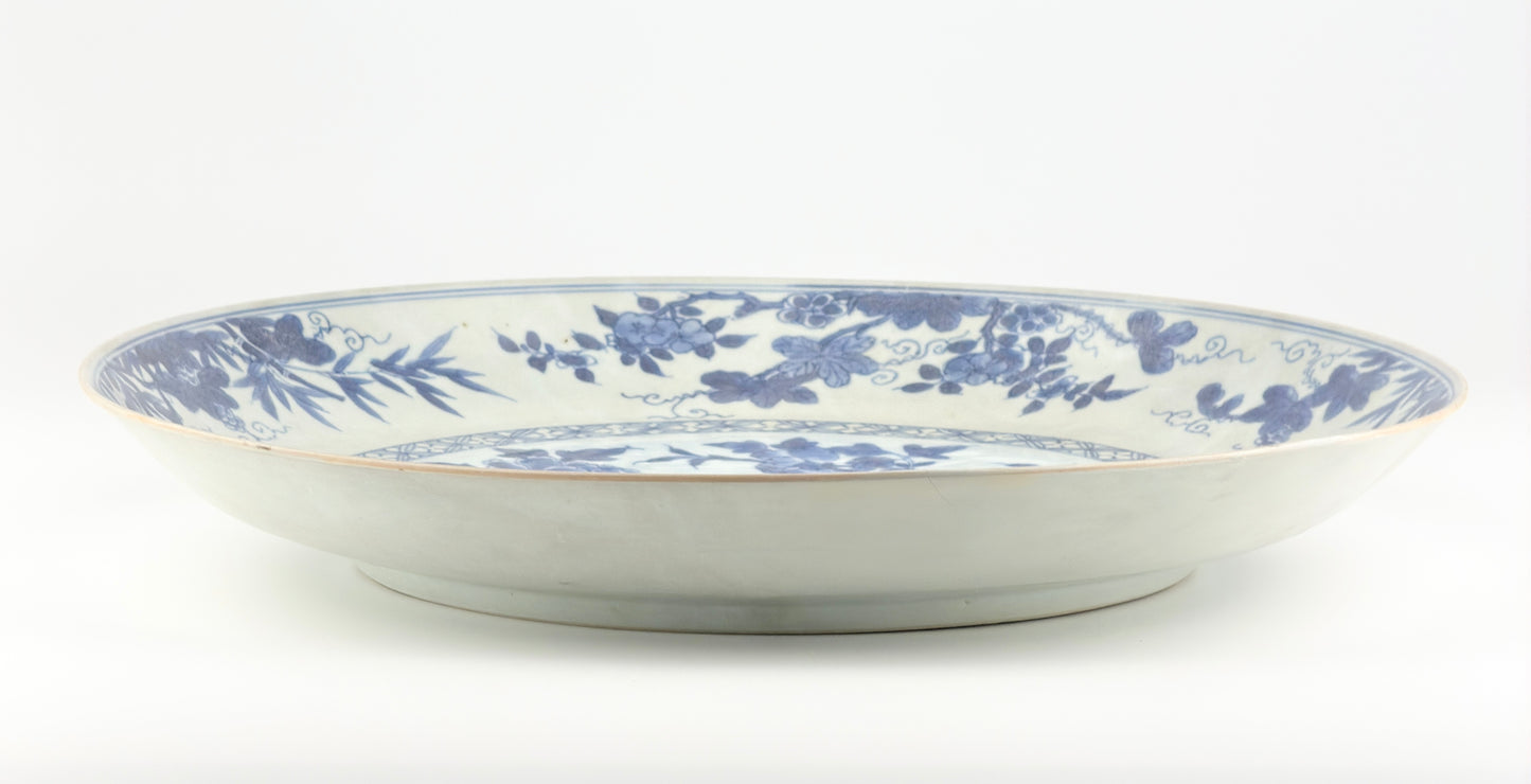PEACOCK IN SPLENDOUR PATTERN BLUE AND WHITE DISH CIRCA 1725, QING DYNASTY, YONGZHENG