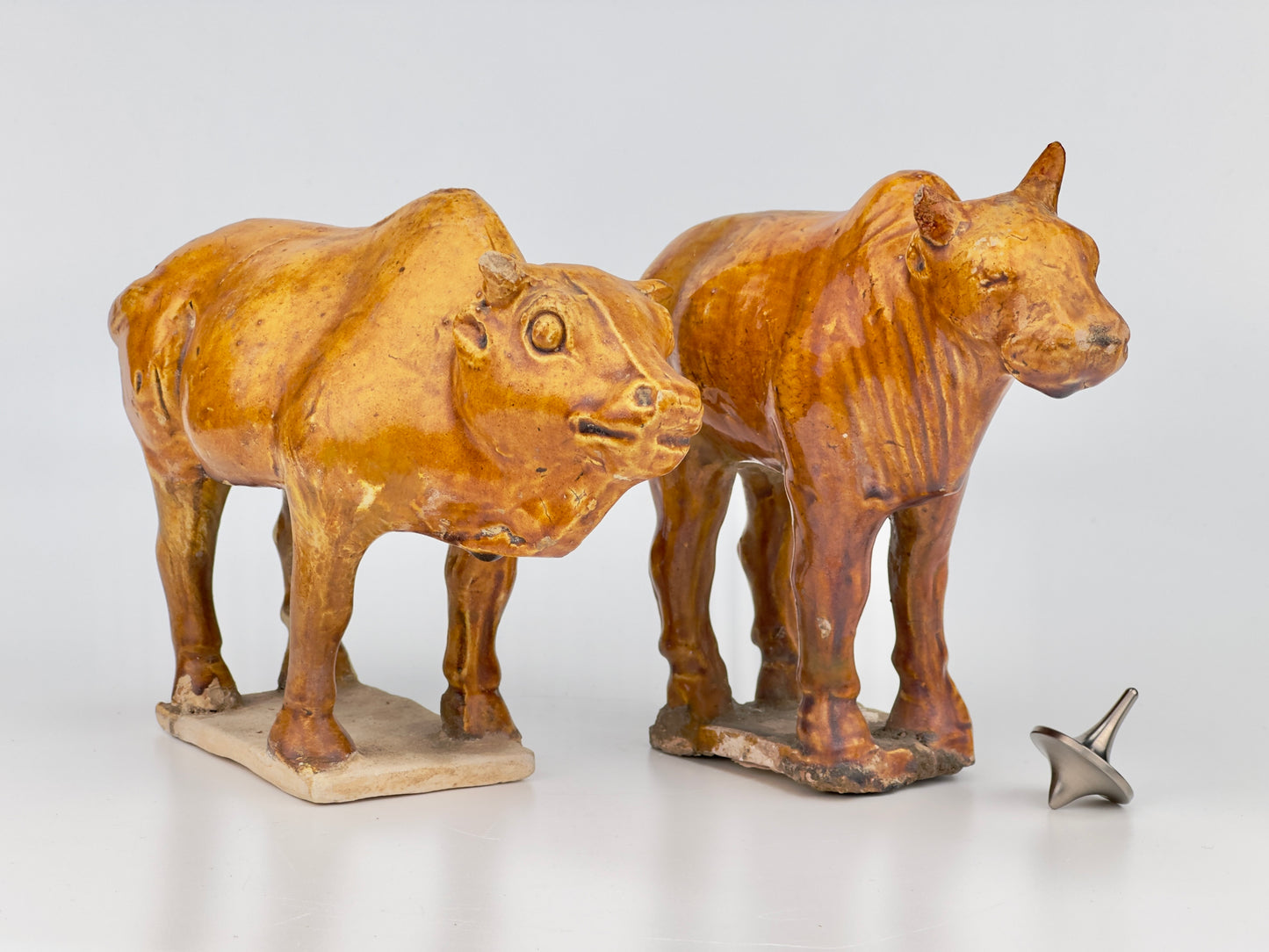 AMBER-GLAZED POTTERY FIGURE OF TWO SACRED BULLS, TANG-LIAO DYNASTY (7-12TH CENTURY)