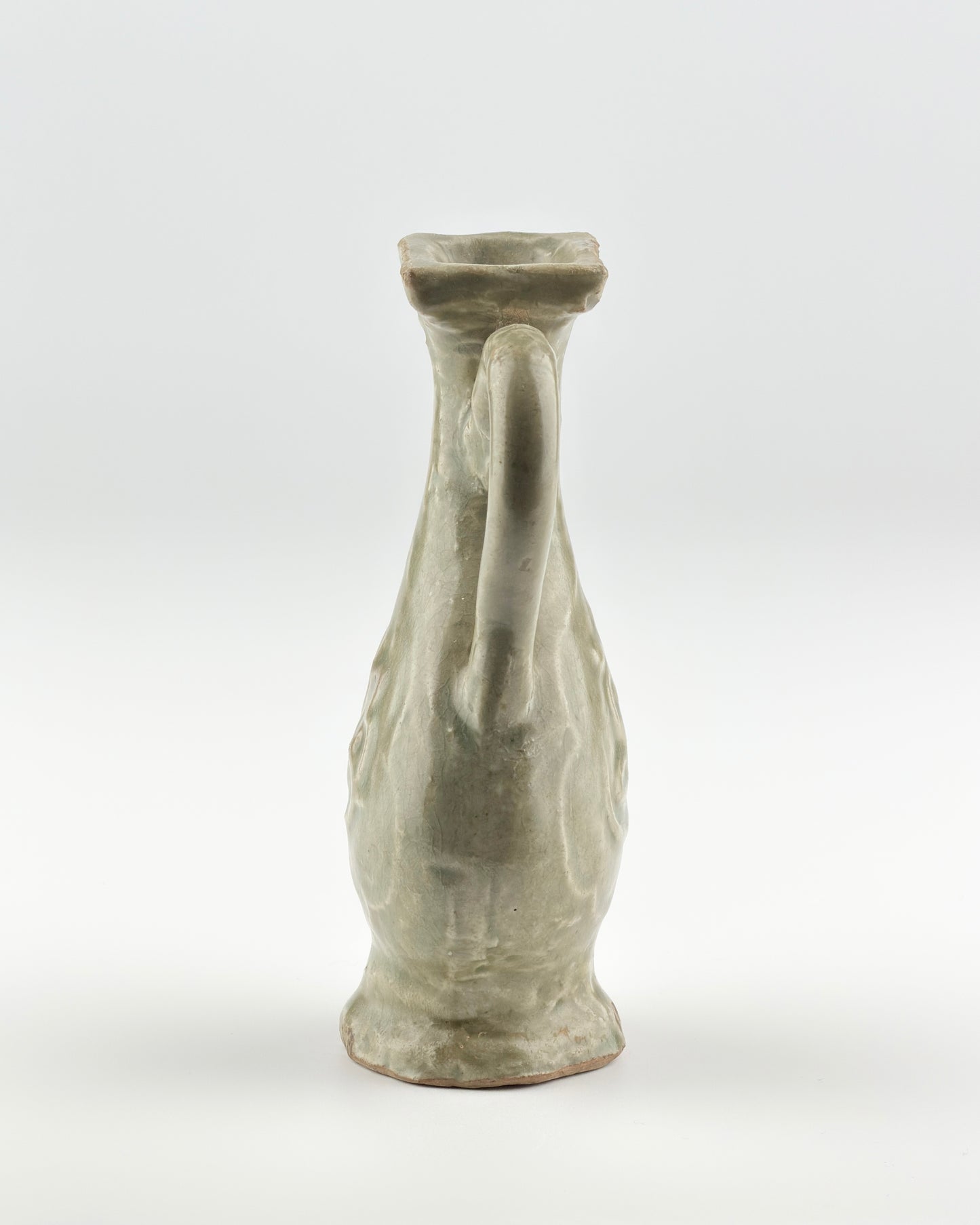 MOLDED LONGQUAN CELADON 'FU SHOU' EWER, MING DYNASTY