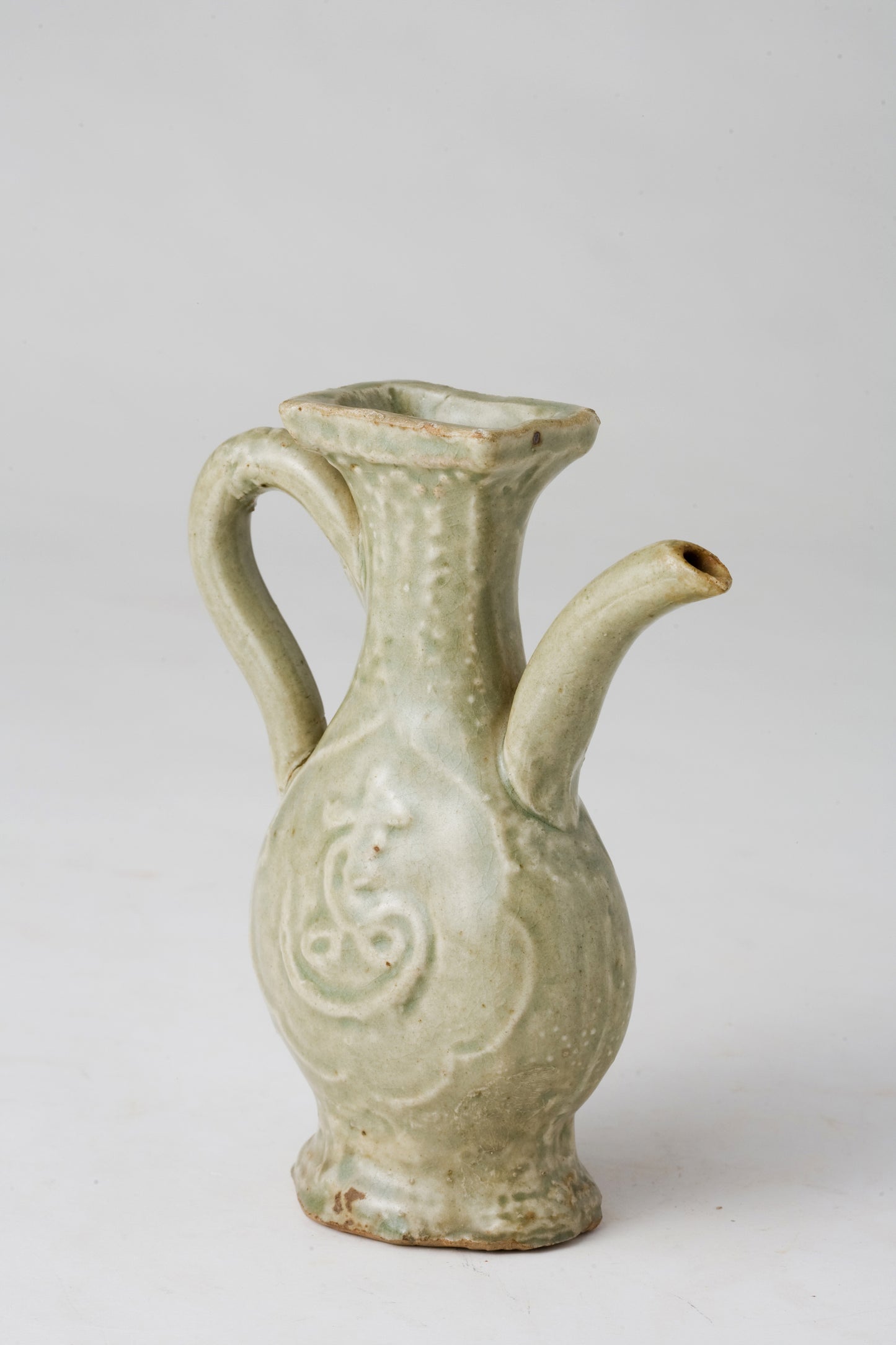 MOLDED LONGQUAN CELADON 'FU SHOU' EWER, MING DYNASTY