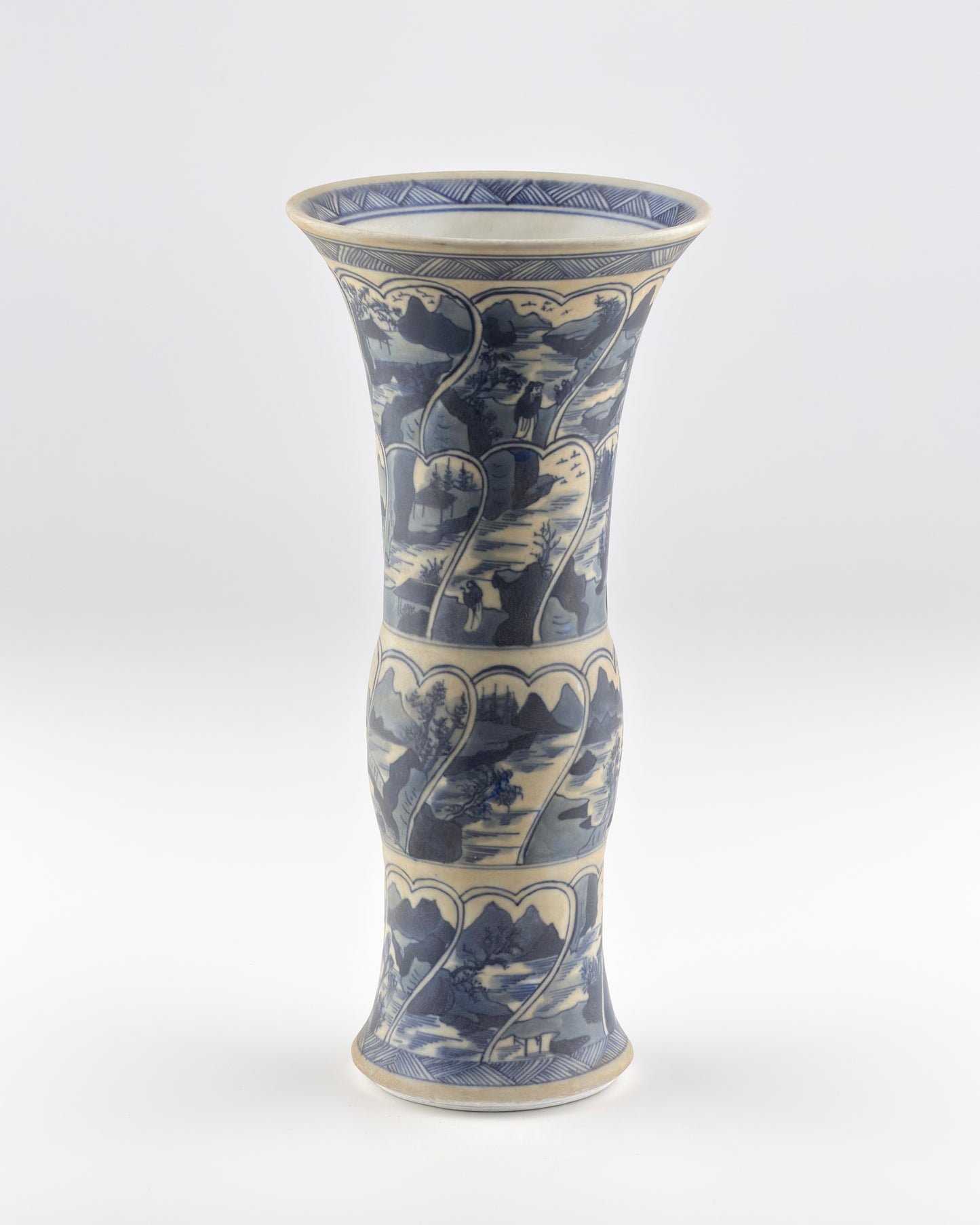 ANCIENT GU SHAPE BLUE AND WHITE 'RIVERSCAPES' VASE, QING DYNASTY, KANGXI ERA, CIRCA 1690