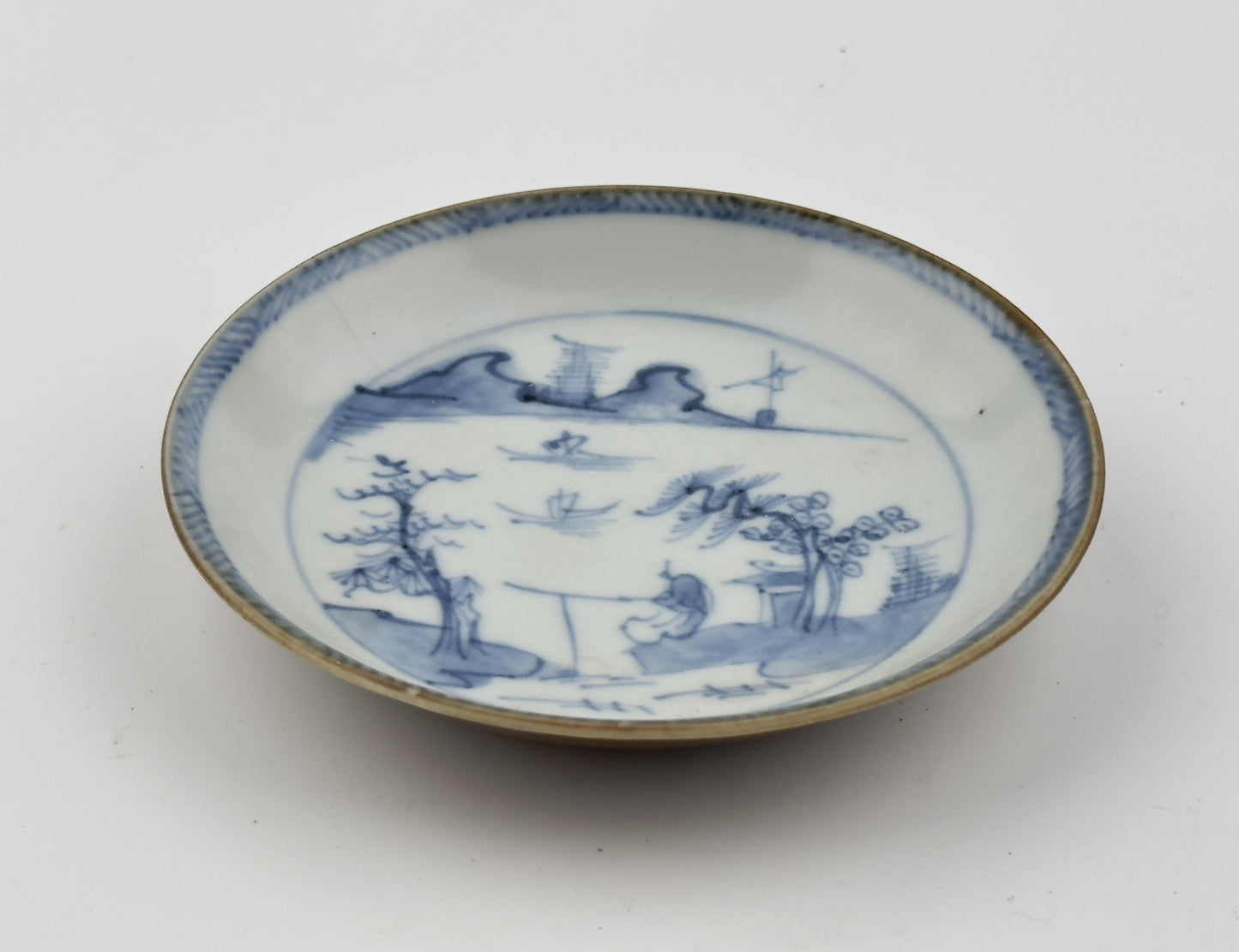 PASSING BOAT AND FIGURE PATTERN BLUE AND WHITE SAUCER, CIRCA 1725, QING DYNASTY, YONGZHENG ERA