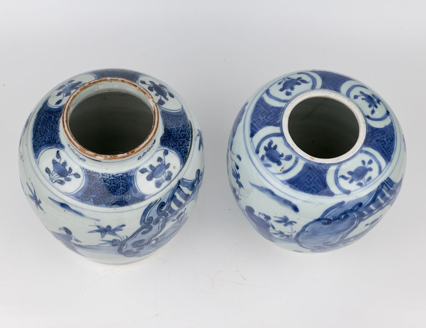 Two Chinese blue and white jars, painted with eight figures in a garden, marked on the bottom with a sitting rabbit(blue hare), Transitional period(Late Ming dynasty)