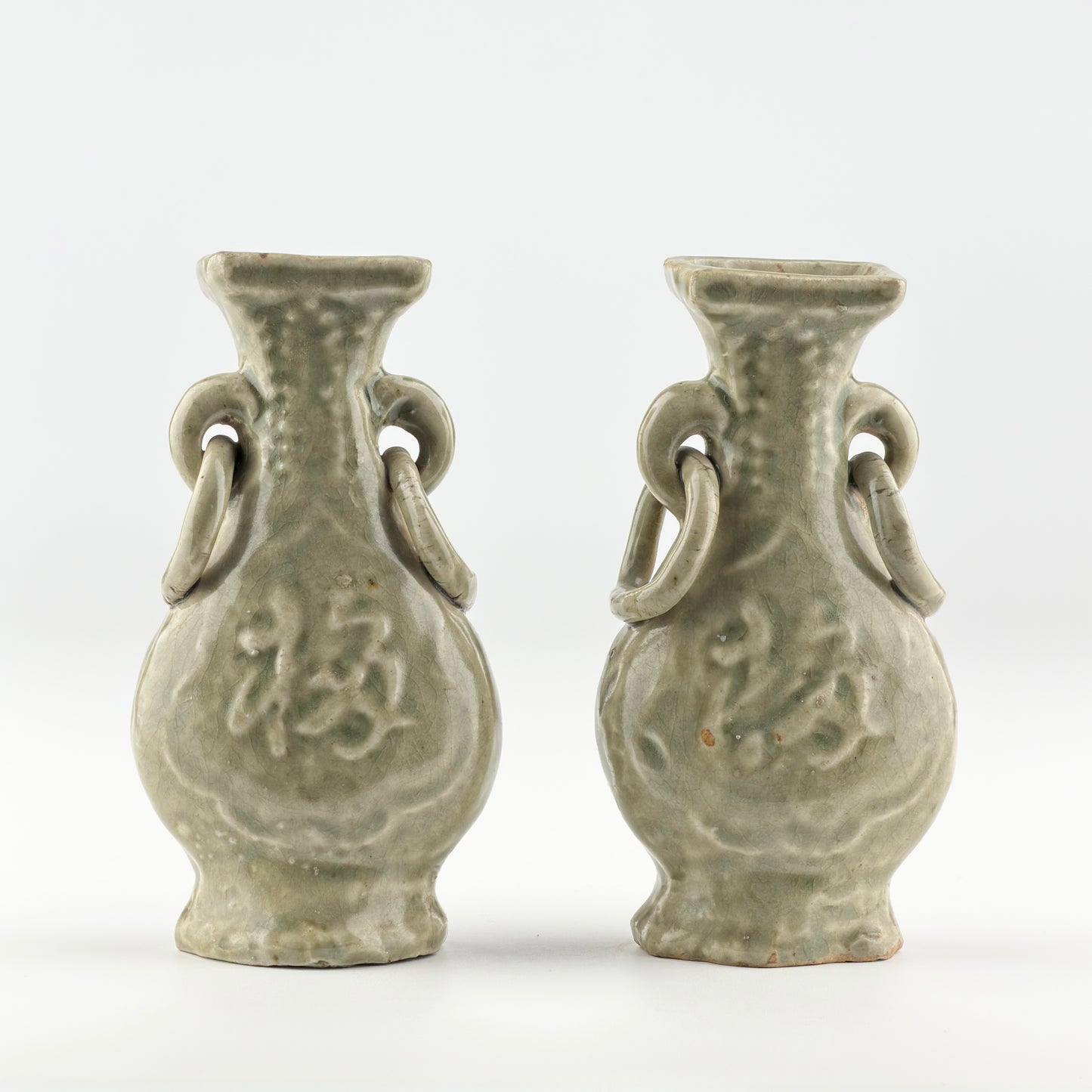 TWO MOLDED LONGQUAN CELADON 'FU SHOU' VASES, MING DYNASTY