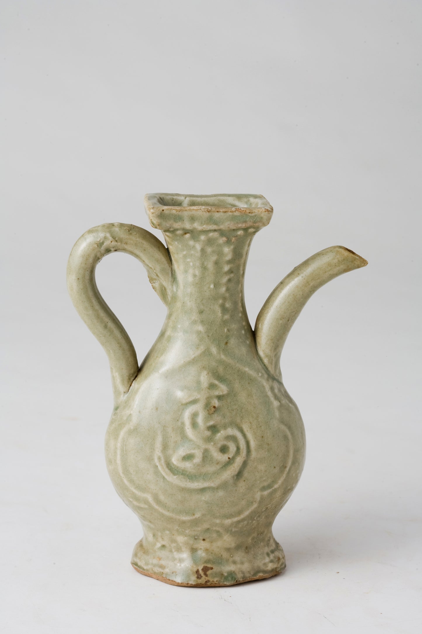 MOLDED LONGQUAN CELADON 'FU SHOU' EWER, MING DYNASTY