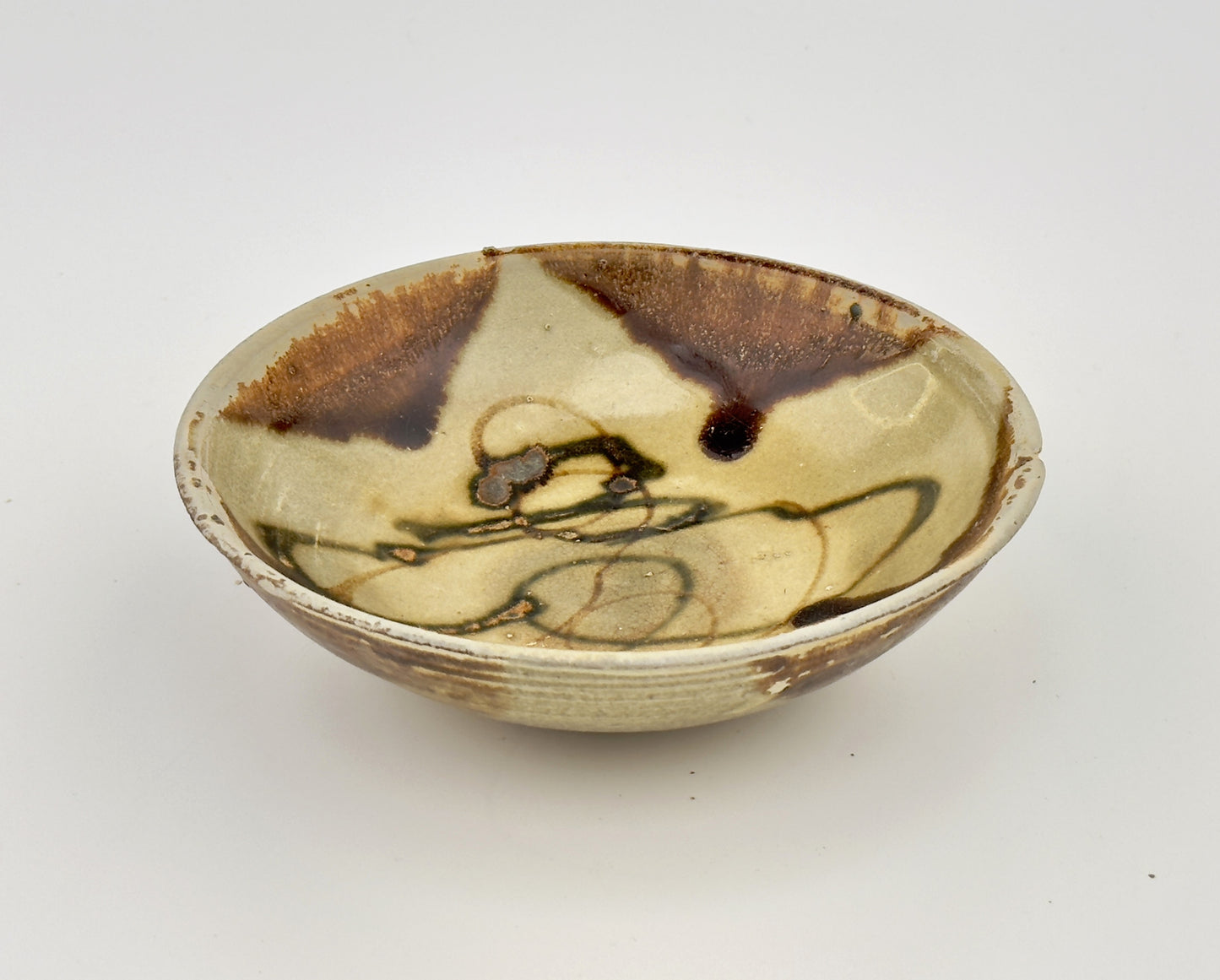 BELITUNG SHIP, CHANGSHA BOWL WITH ABSTRACT PATTERNS PRESUMED TO BE ISLAMIC SYMBOLS, TANG PERIOD