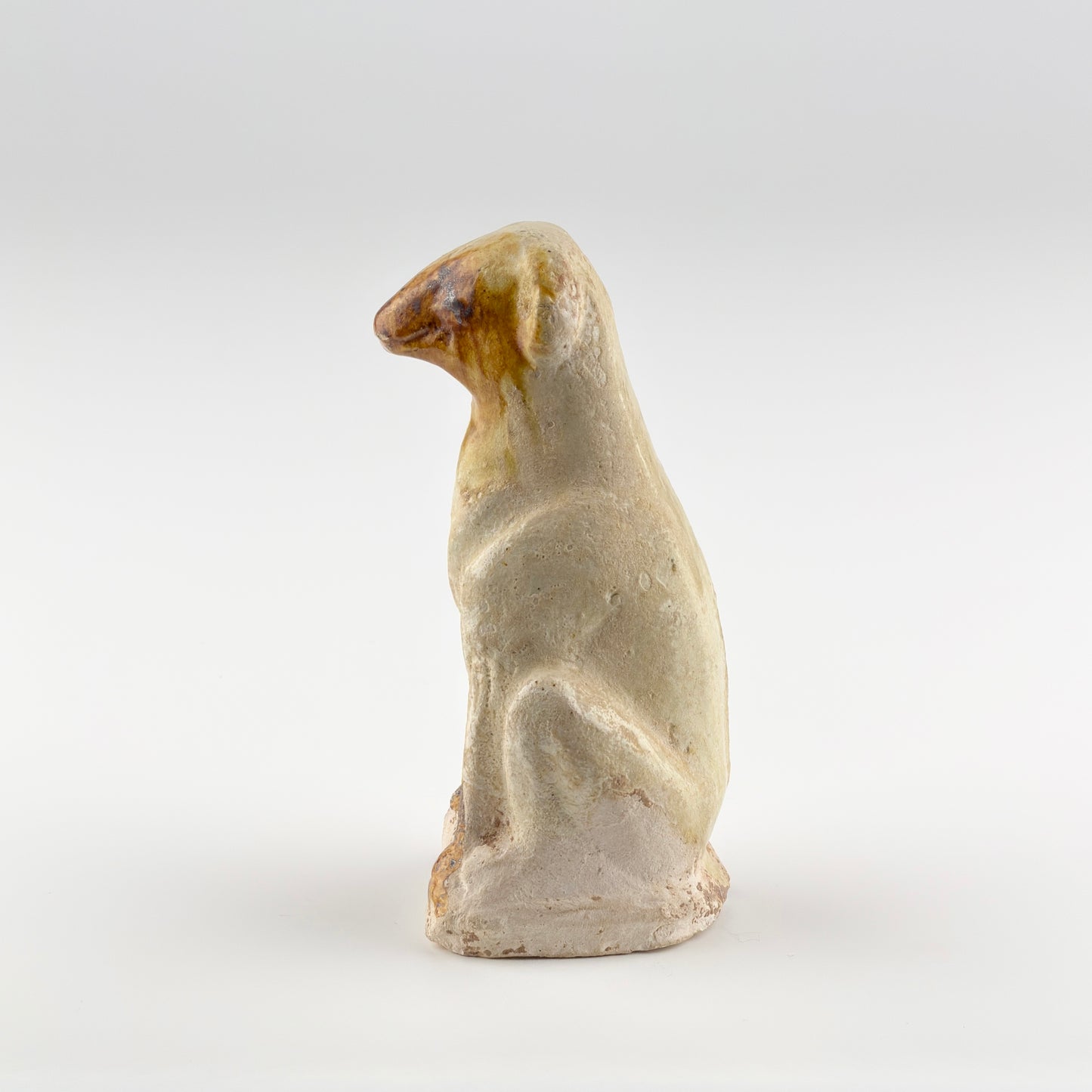 AMBER-GLAZED POTTERY FIGURE OF DOG, TANG-LIAO DYNASTY (7-12TH CENTURY)
