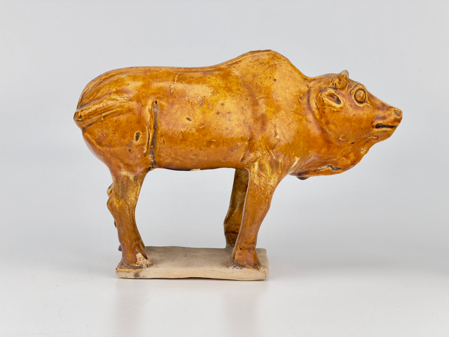 AMBER-GLAZED POTTERY FIGURE OF TWO SACRED BULLS, TANG-LIAO DYNASTY (7-12TH CENTURY)