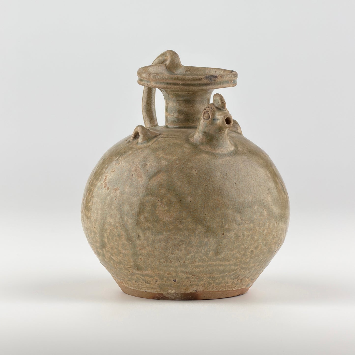 A RARE YUE CELADON CHICKEN-HEAD EWER, JIN-SOUTHERN DYNASTY