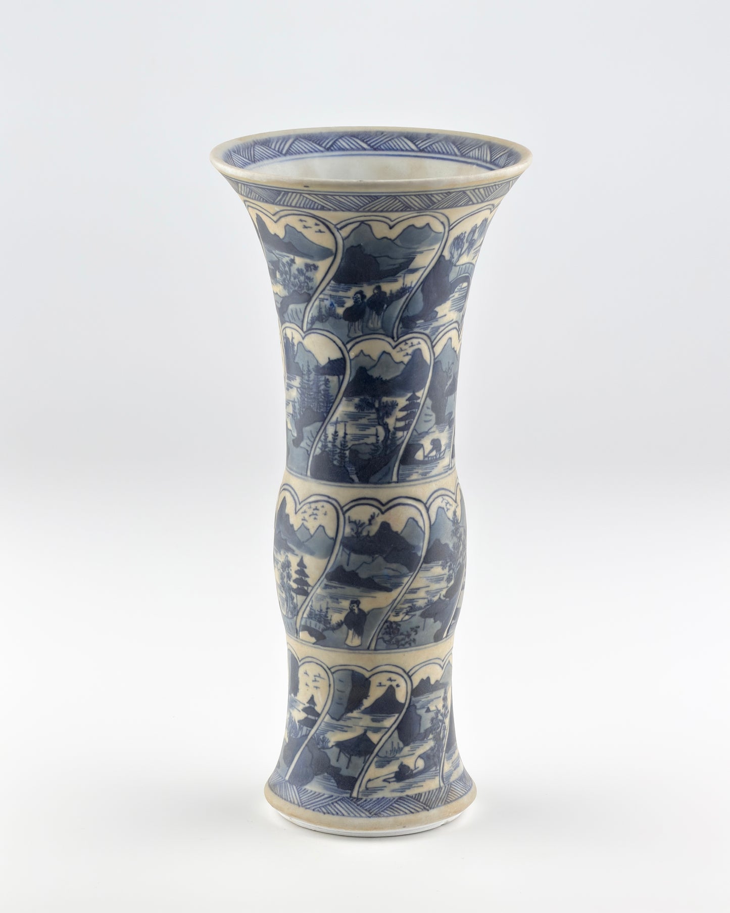 ANCIENT GU SHAPE BLUE AND WHITE 'RIVERSCAPES' VASE, QING DYNASTY, KANGXI ERA, CIRCA 1690