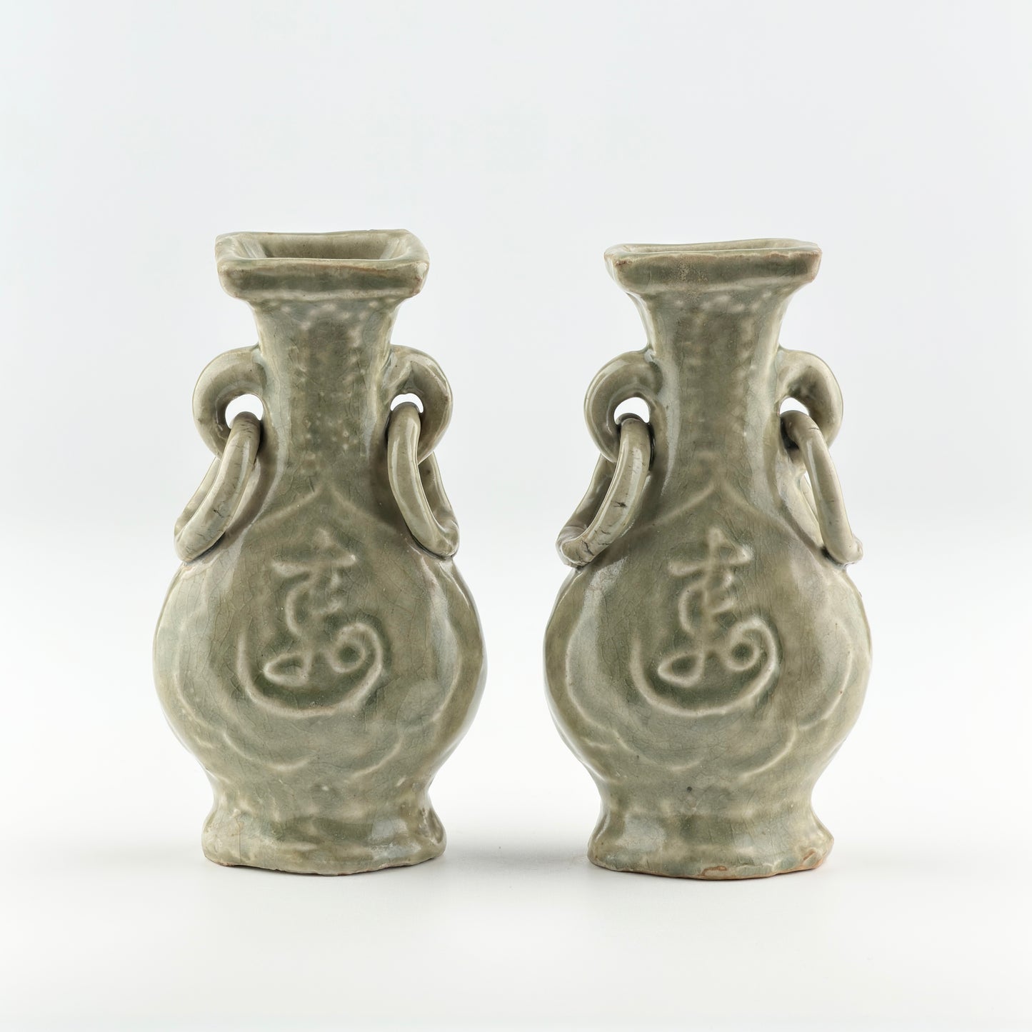 TWO MOLDED LONGQUAN CELADON 'FU SHOU' VASES, MING DYNASTY